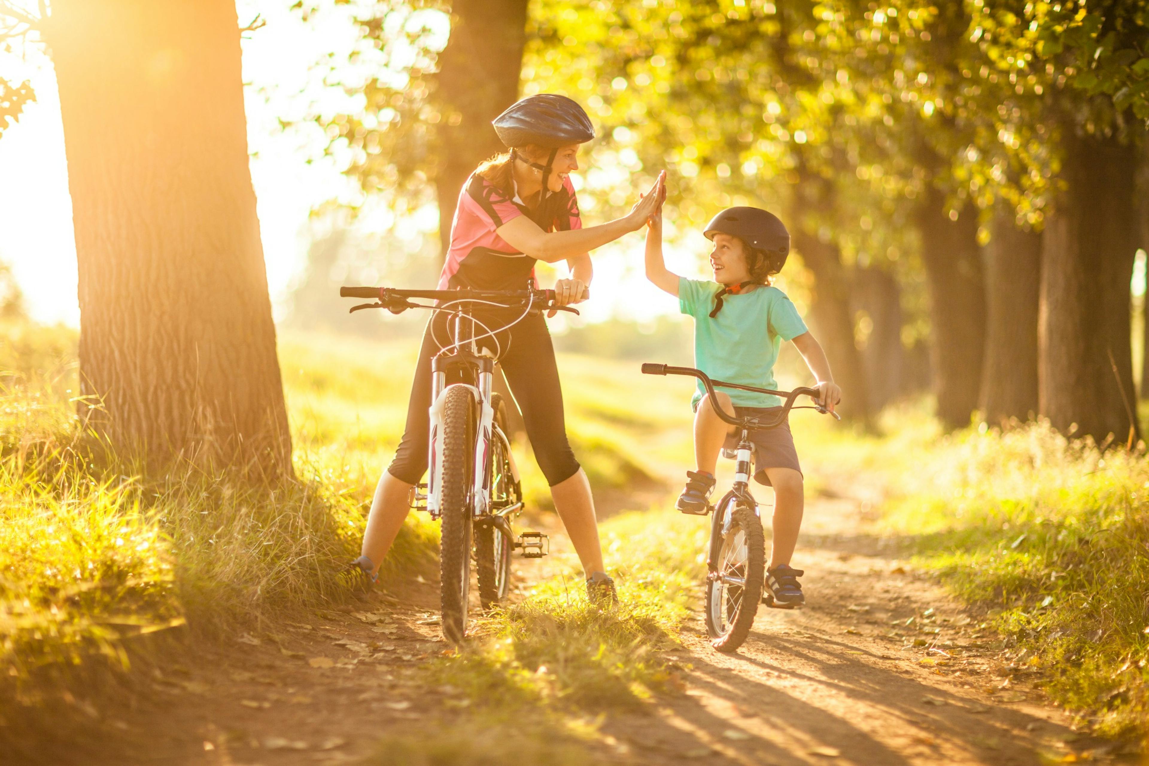 Mother and child out riding bikes.