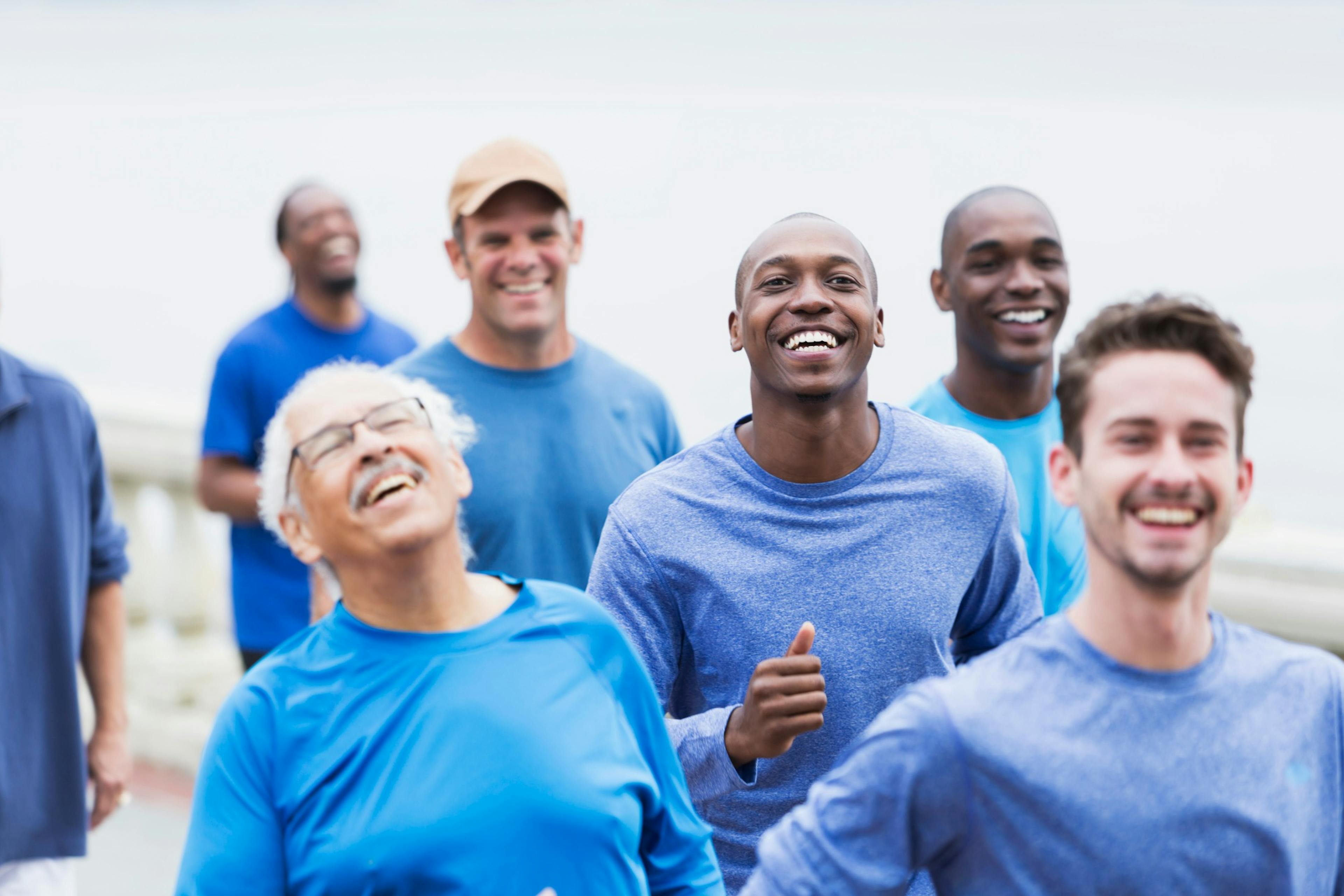 men with cancer out walking in blue shirts