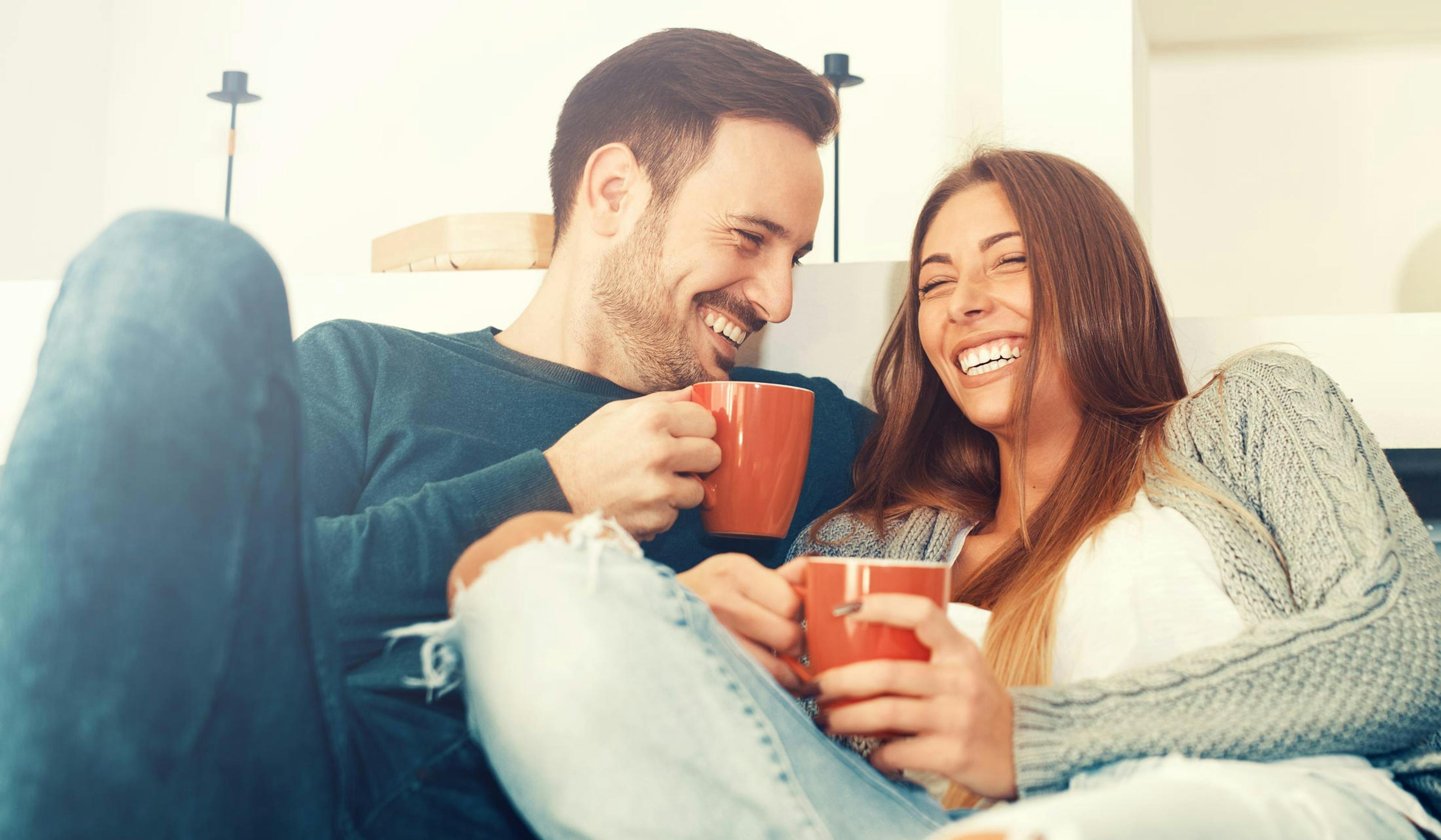 Happy couple at home.