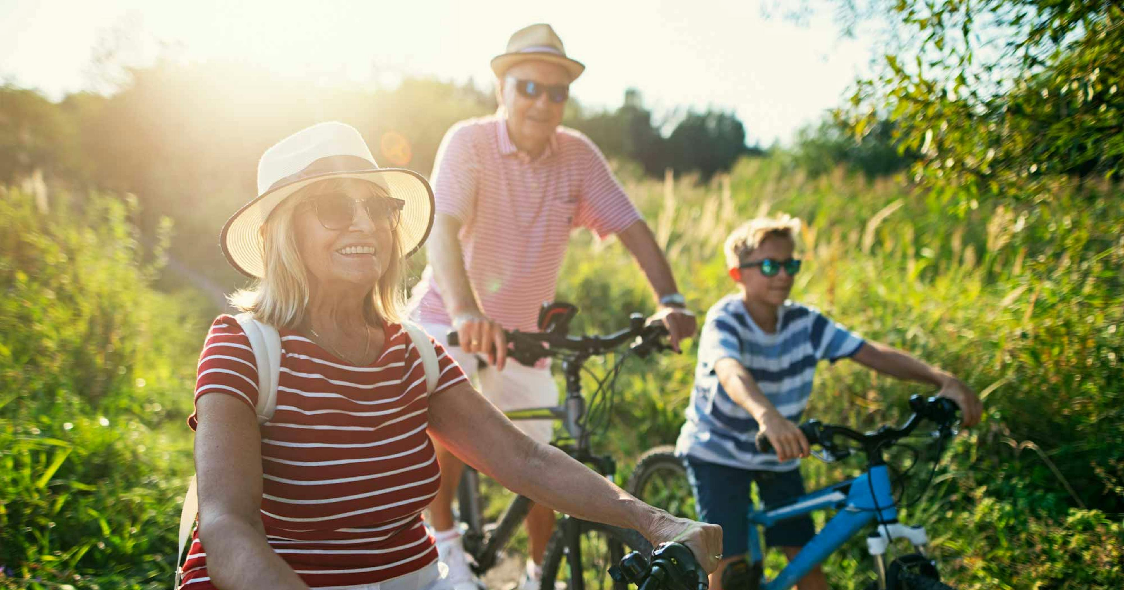 grandparents and grandson riding bikes