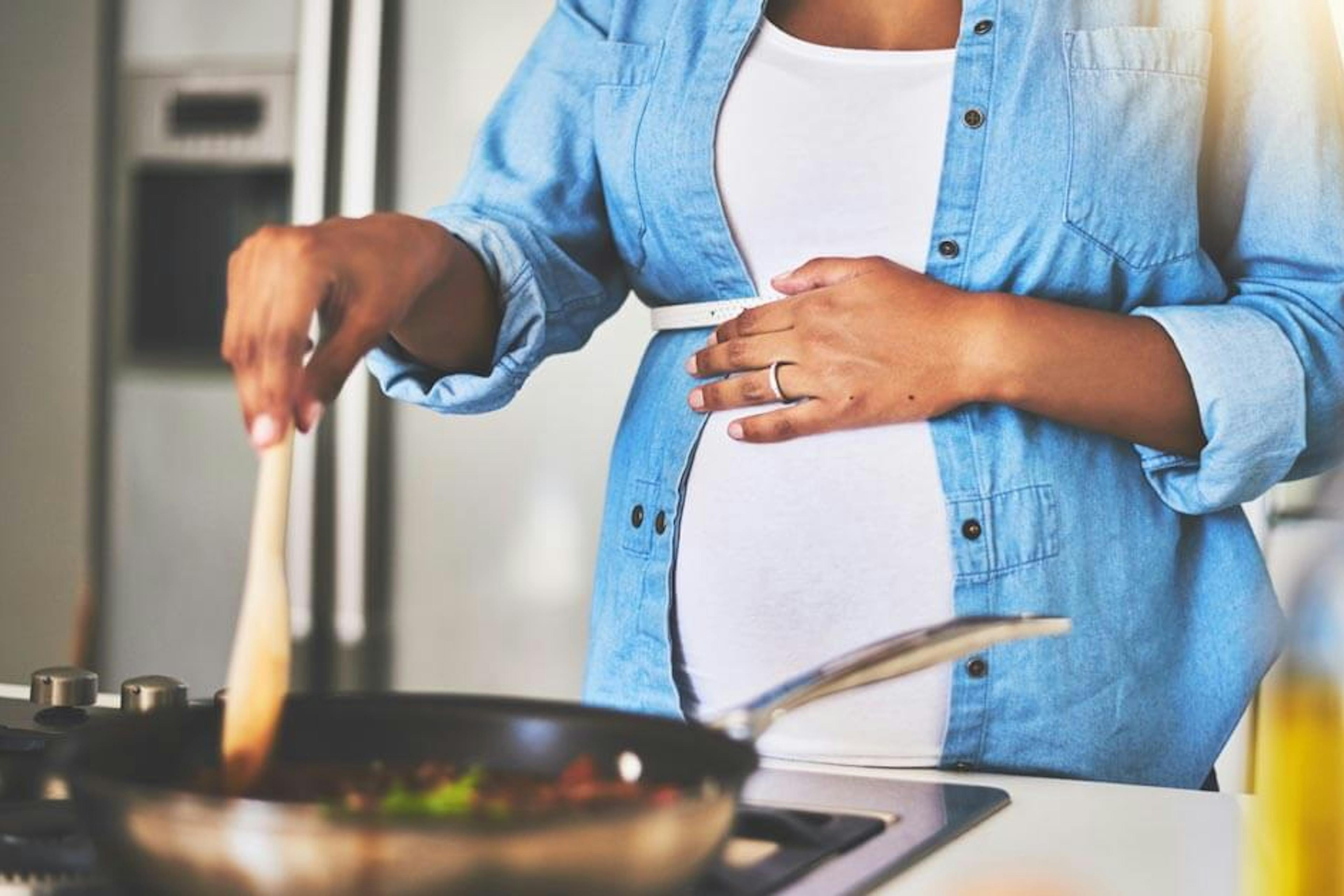 pregnant woman cooking