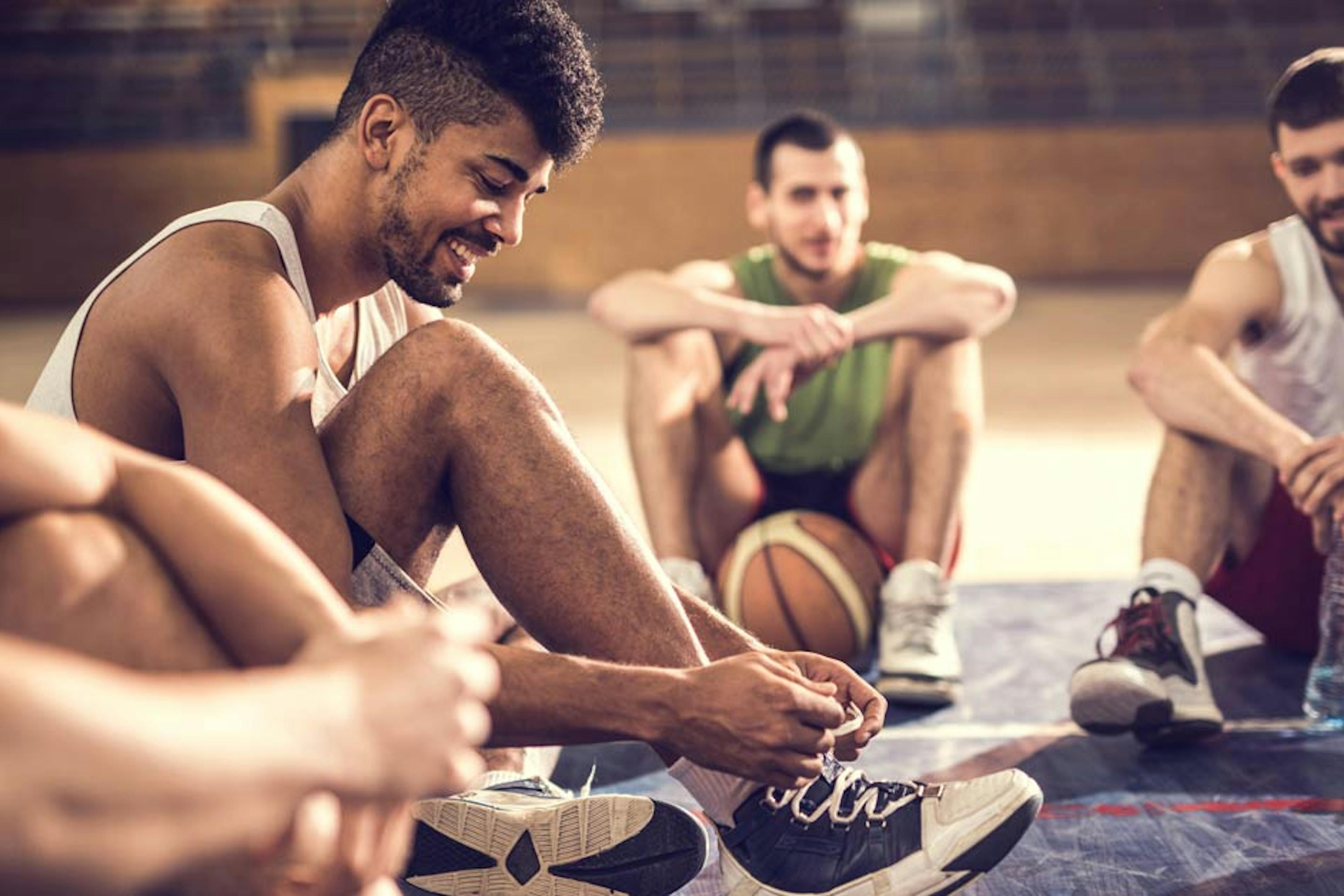 friends gathered before a game of pickup basketball