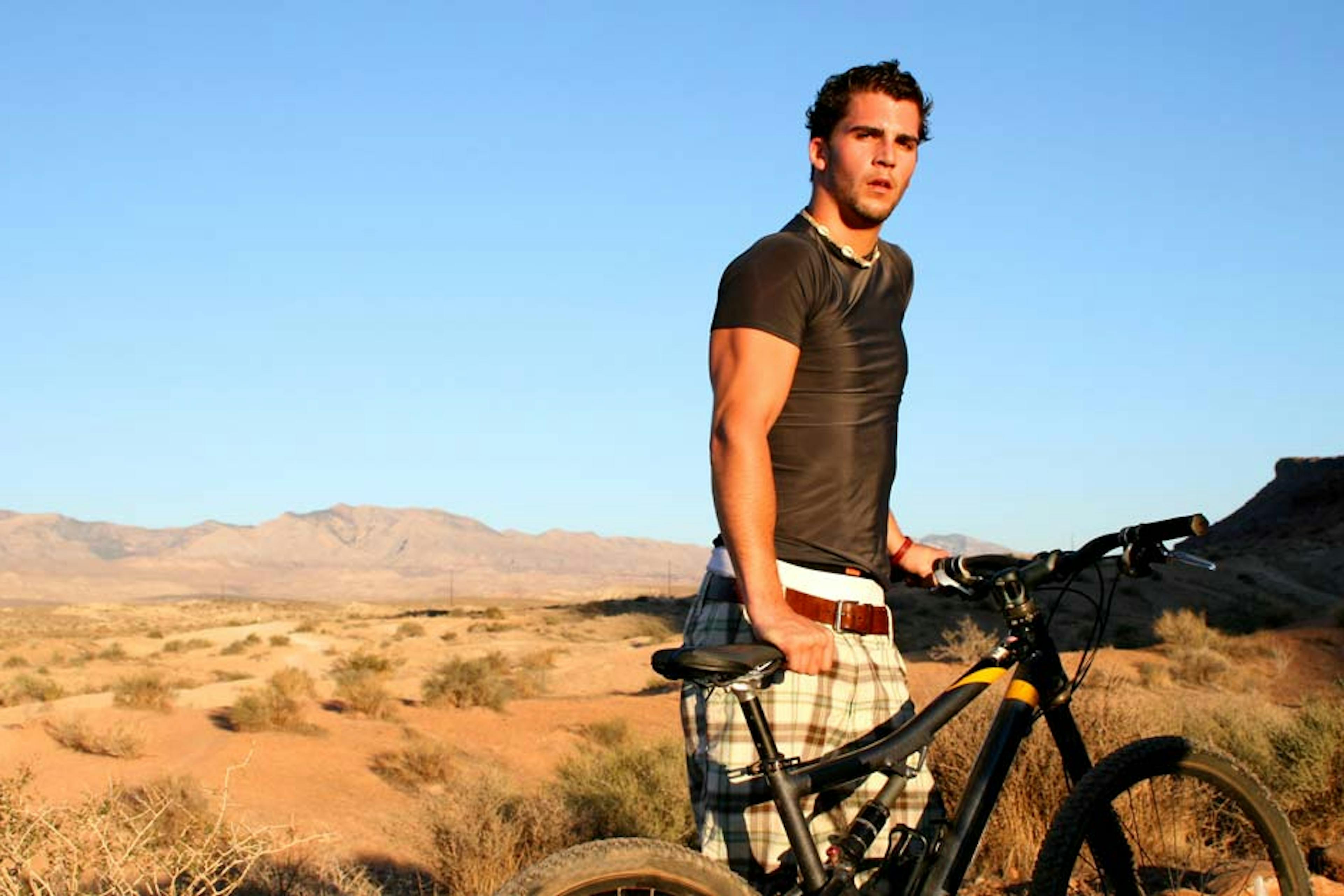 man resting after a hard bike ride