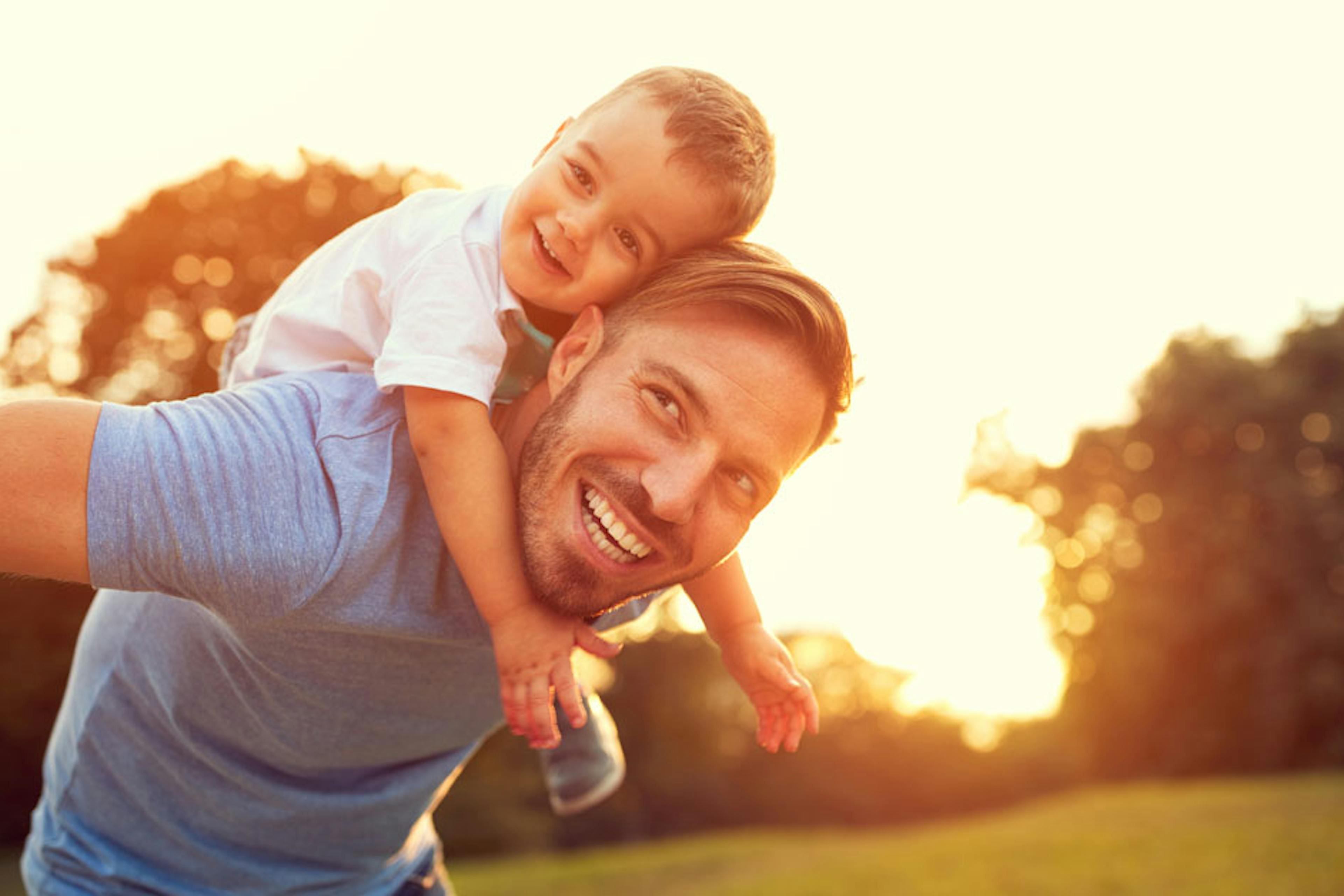 dad and son playing outside