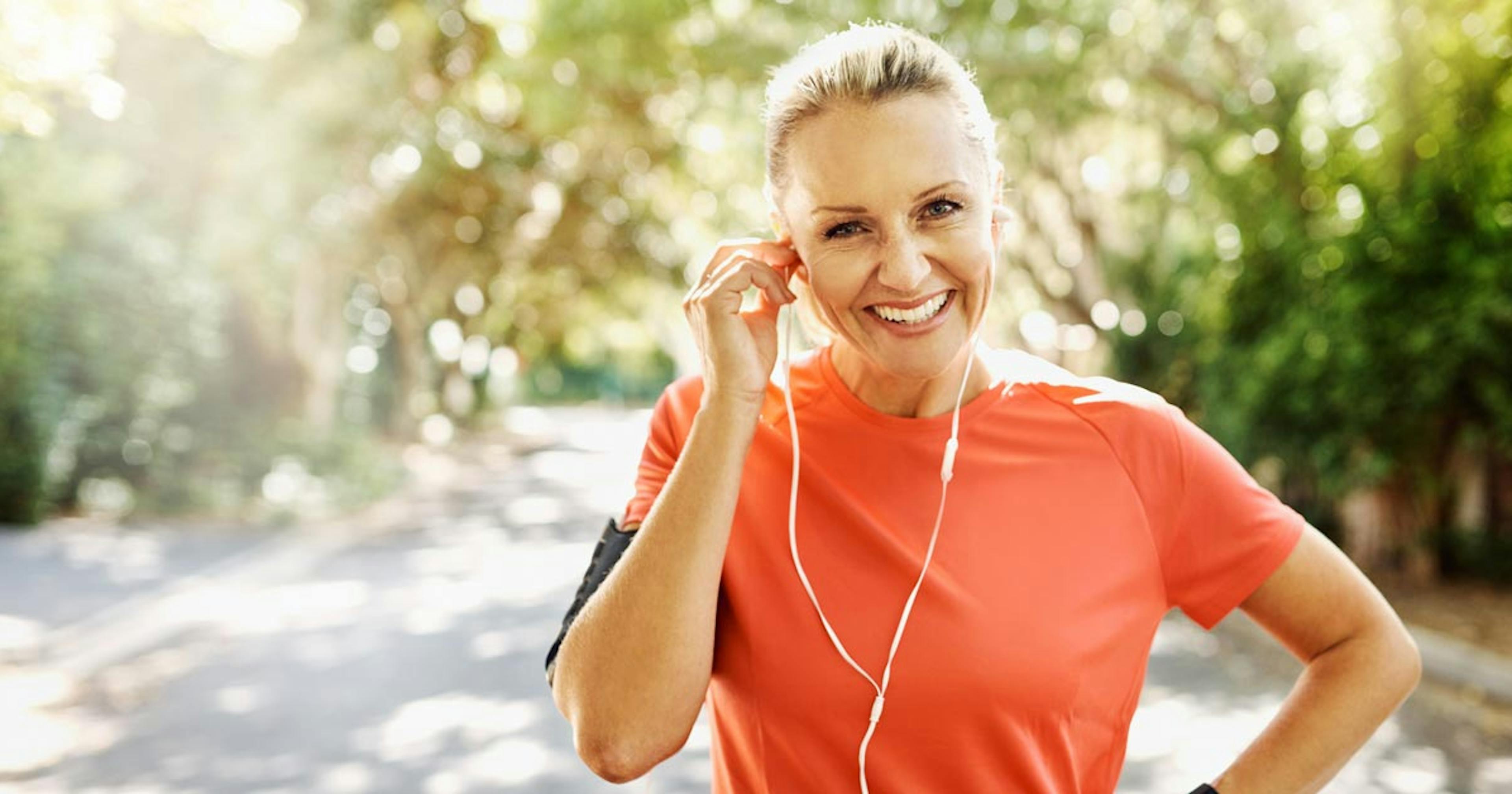 healthy older woman outside working out 