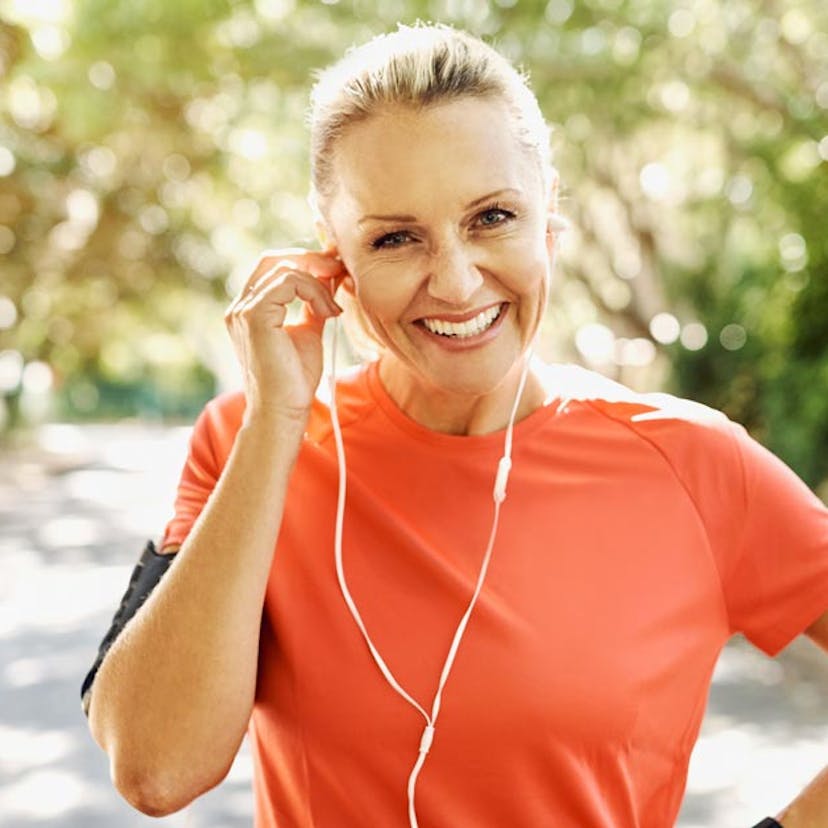 healthy older woman outside working out 