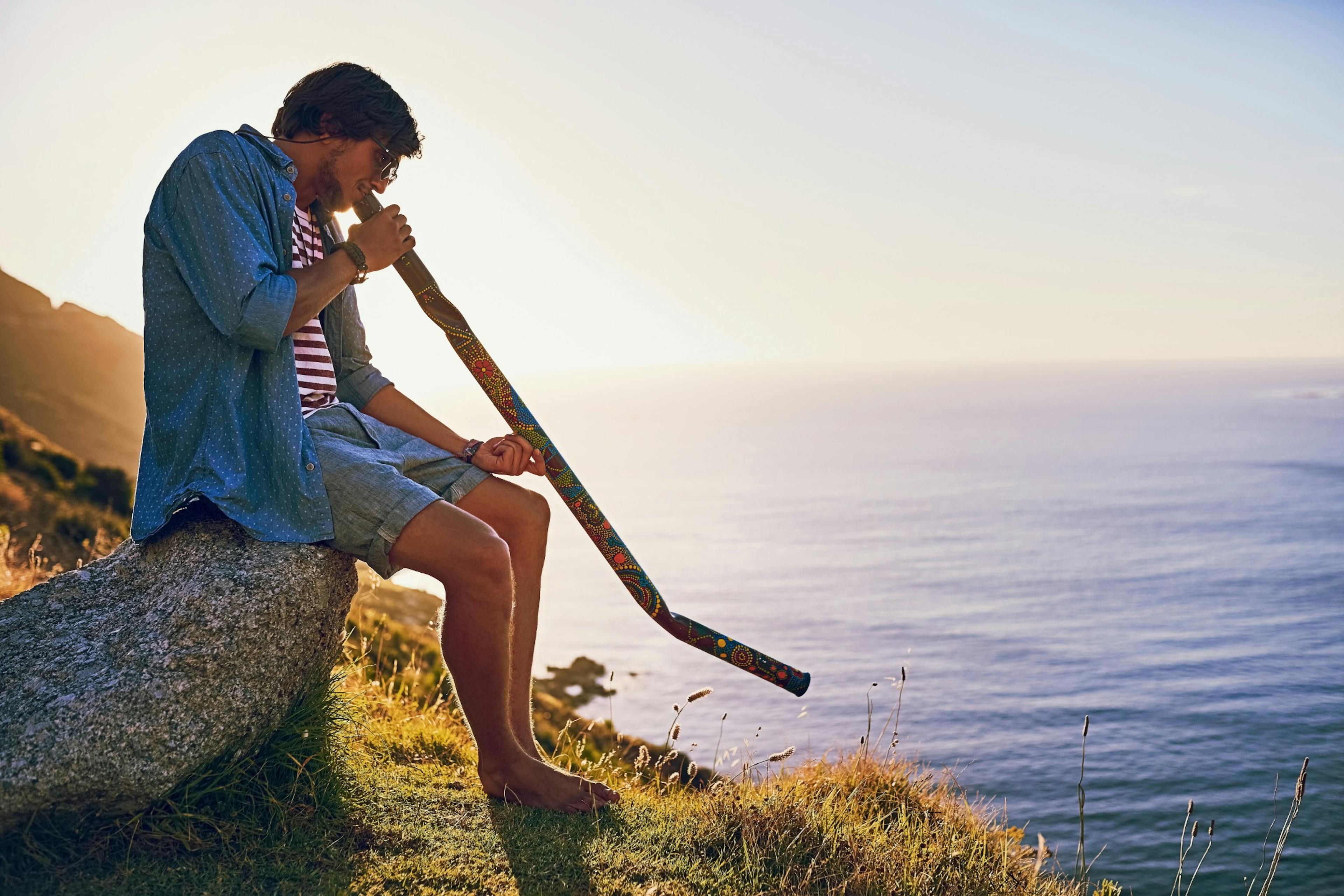 playing the didgeridoo