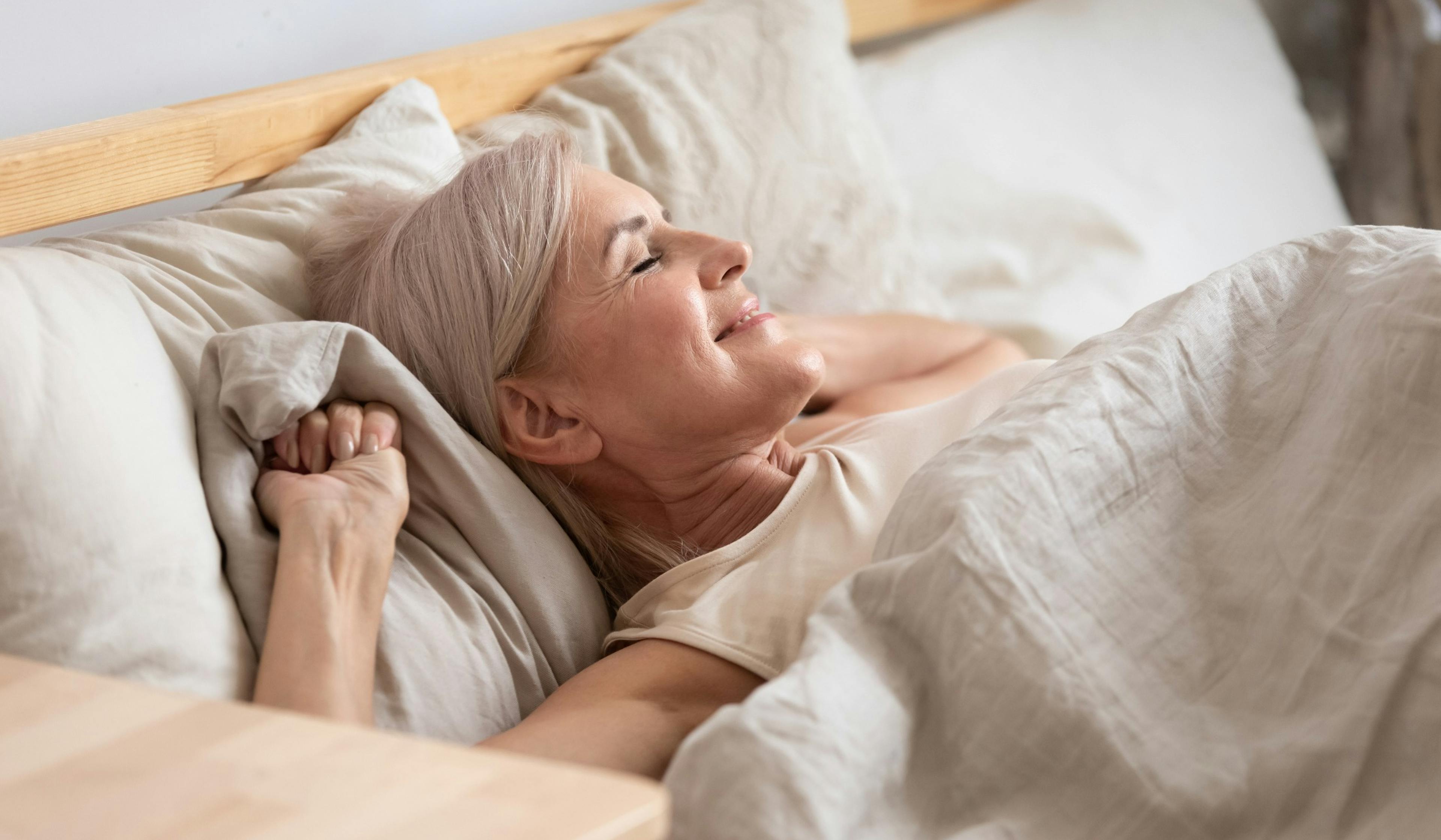 middle age woman waking well-rested