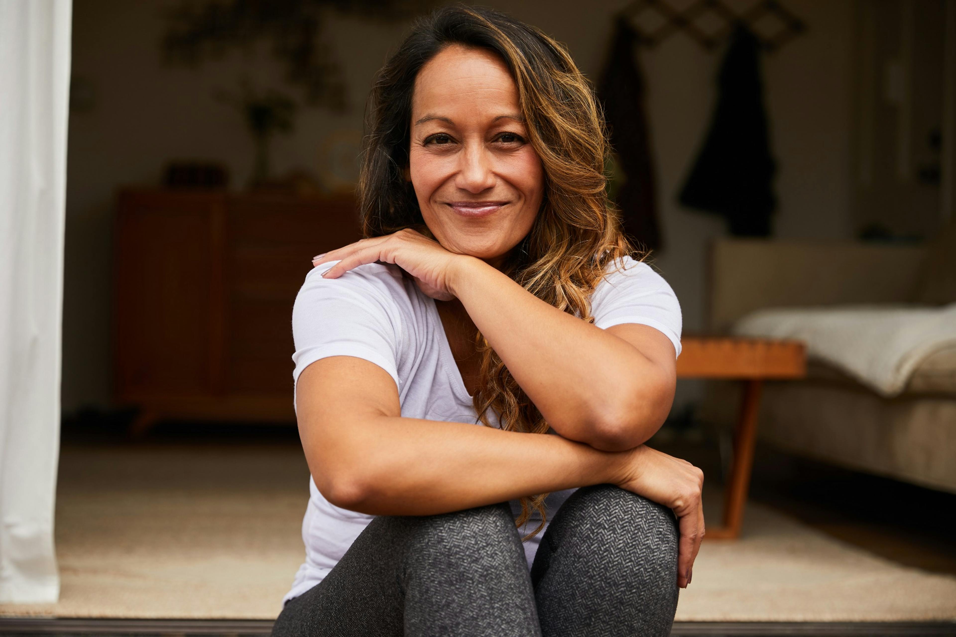 mature woman sitting on her porch