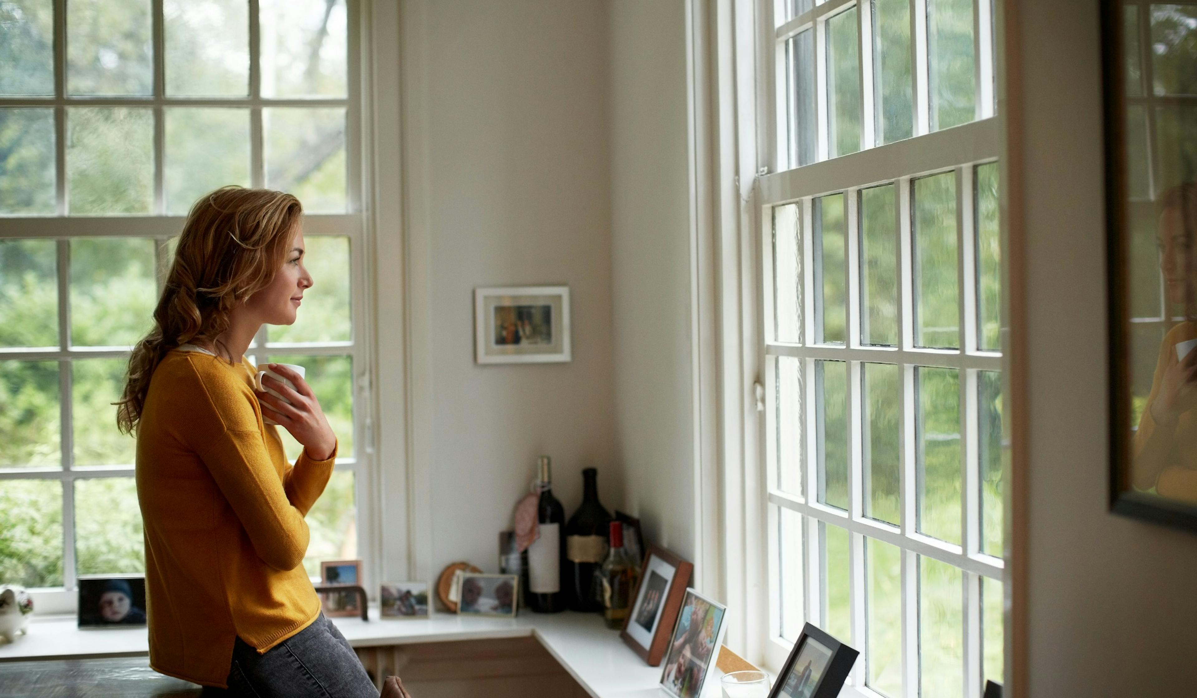 thoughtful woman drinking coffee