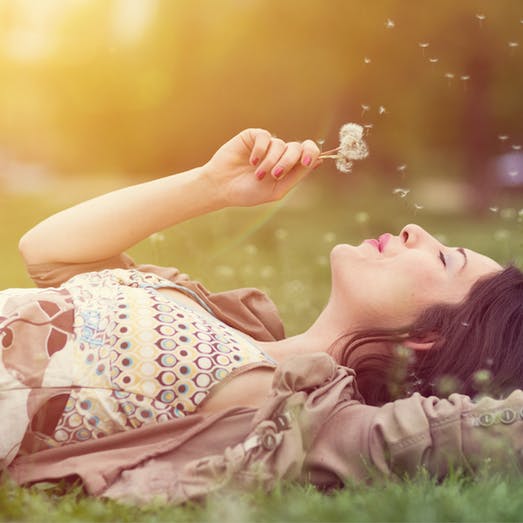 woman laying in grass
