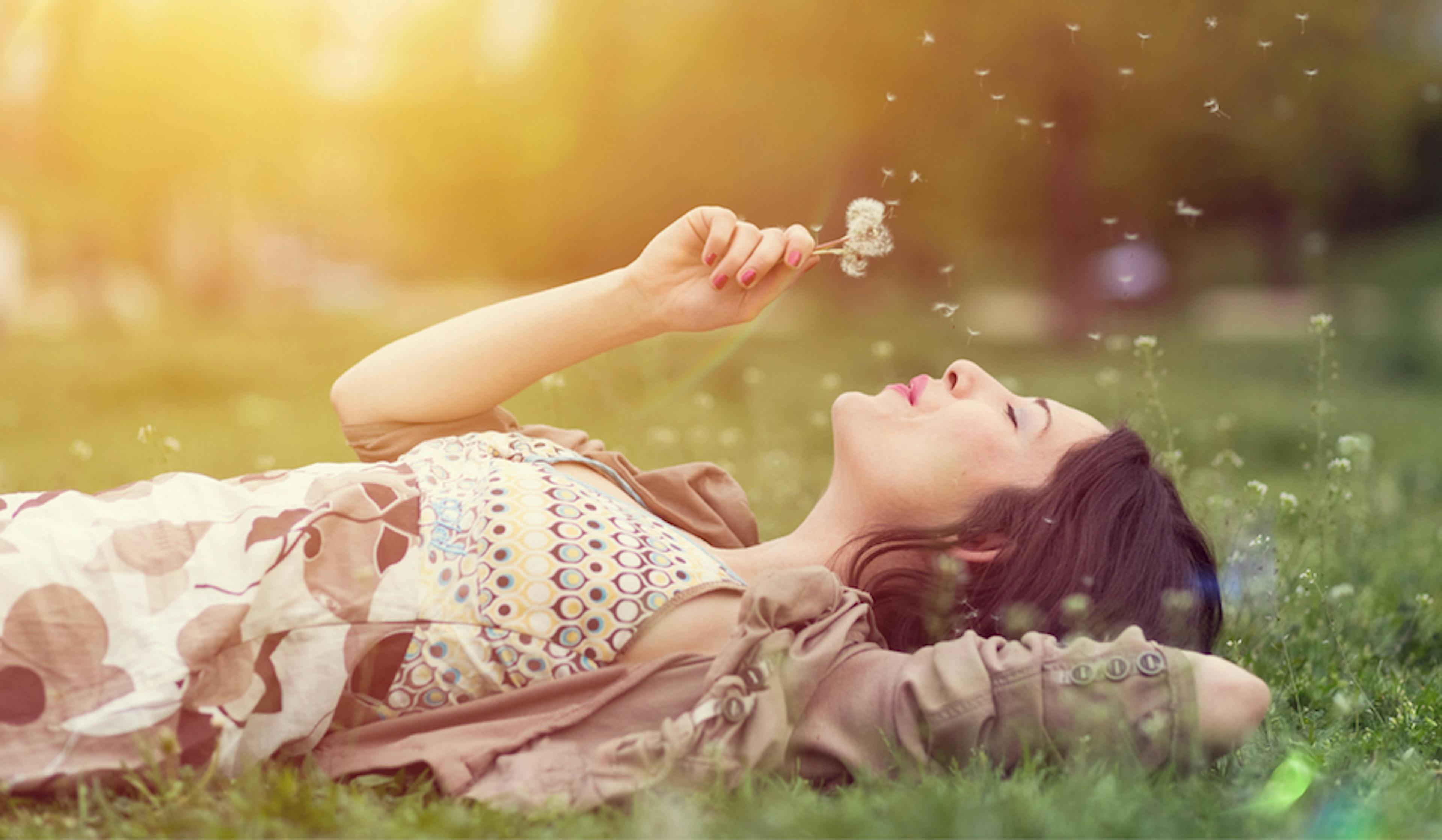 woman laying in grass 