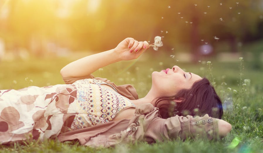 woman laying in grass