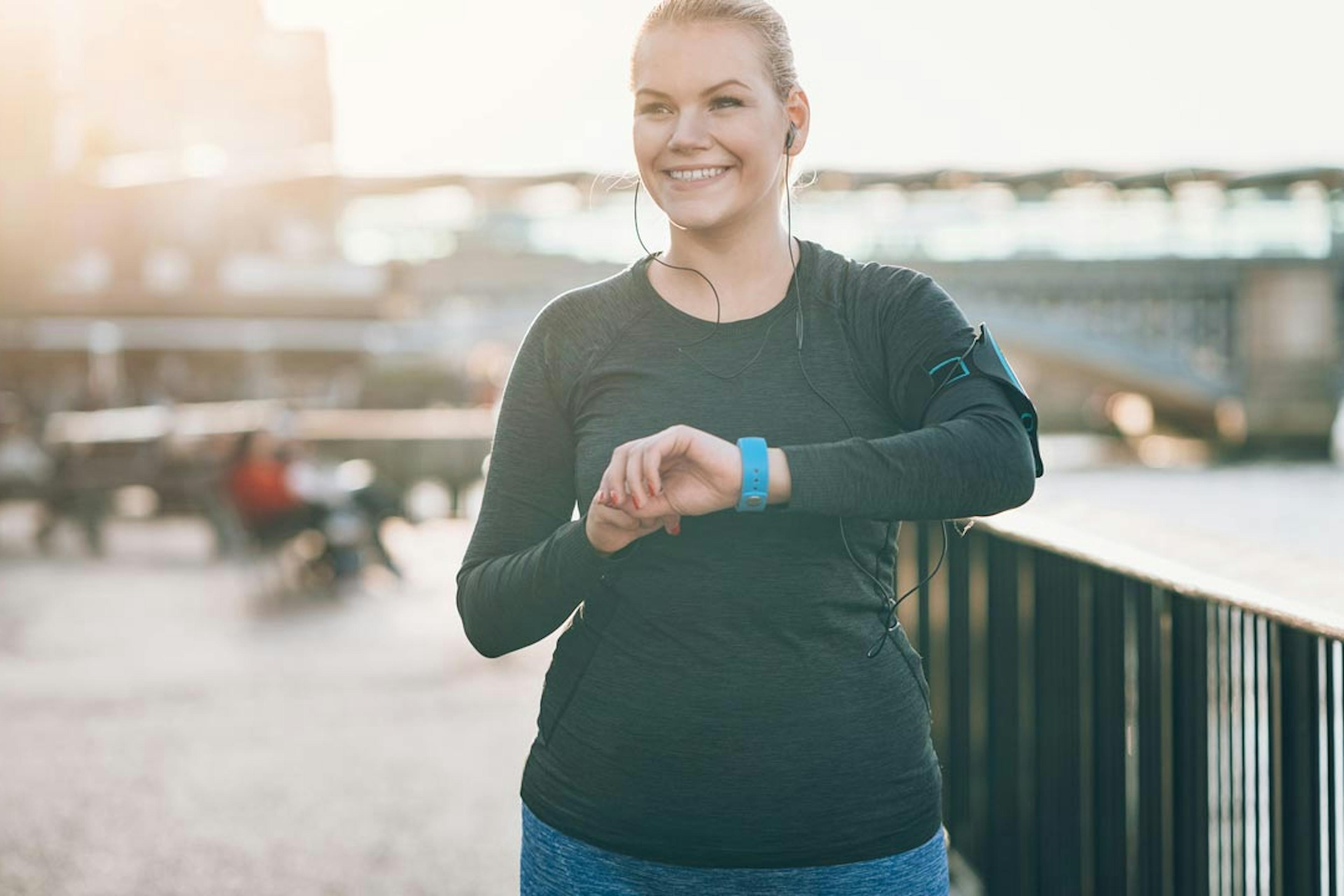 smiling woman working out outside