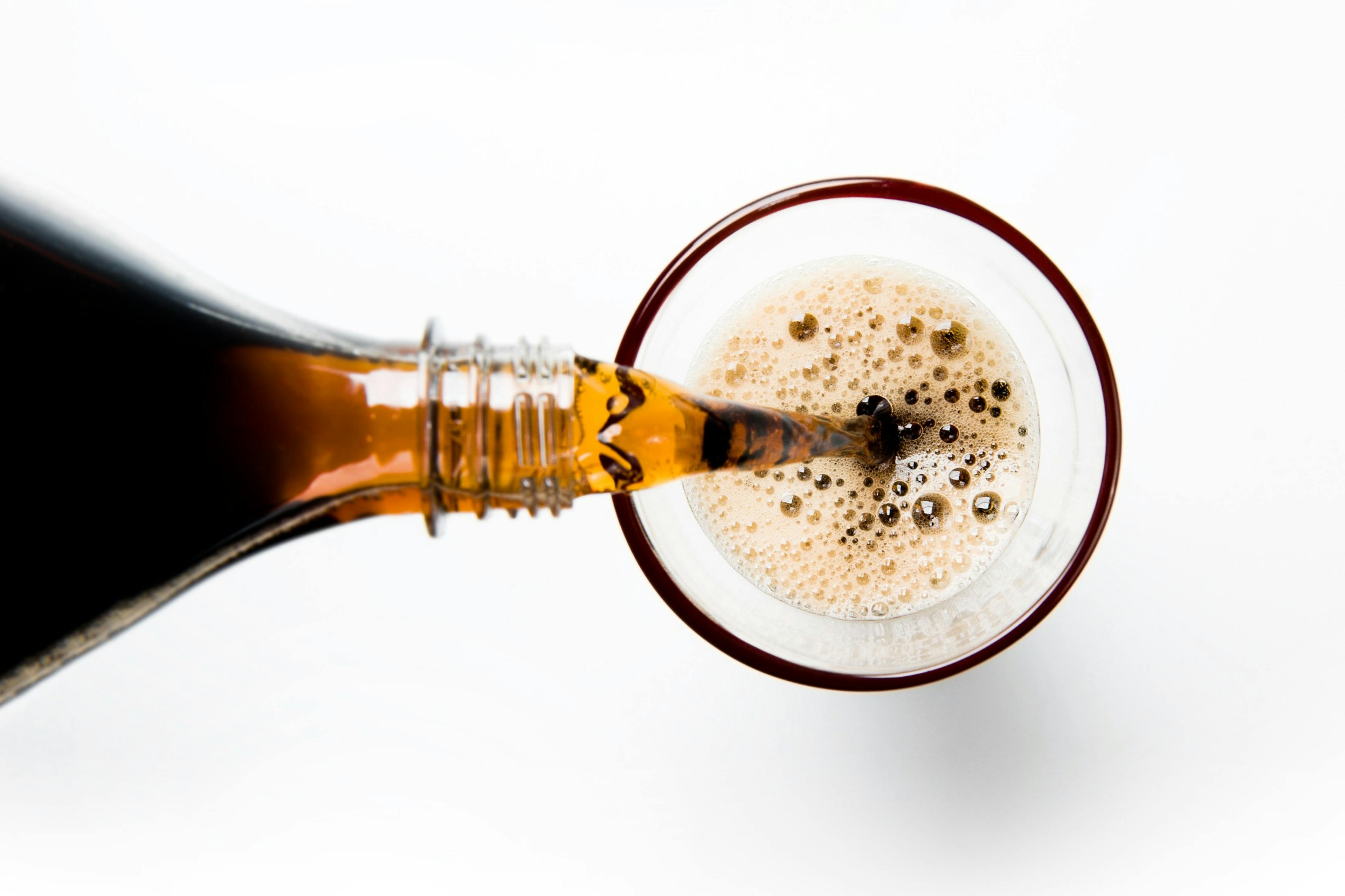 pouring a glass of soda