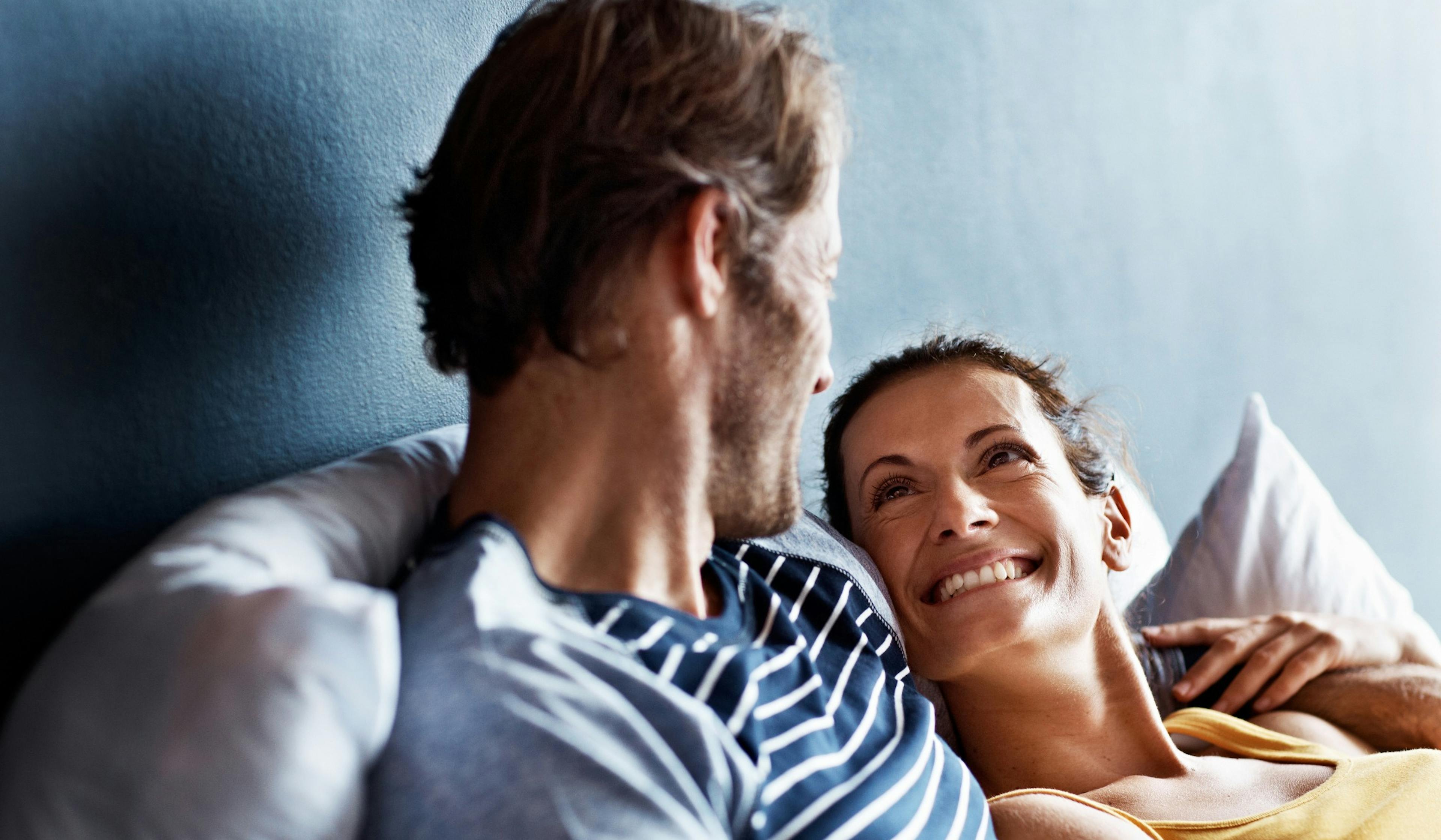 happy couple in bed