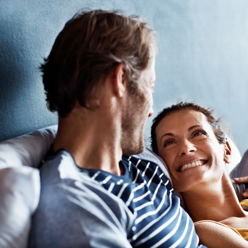 happy couple in bed