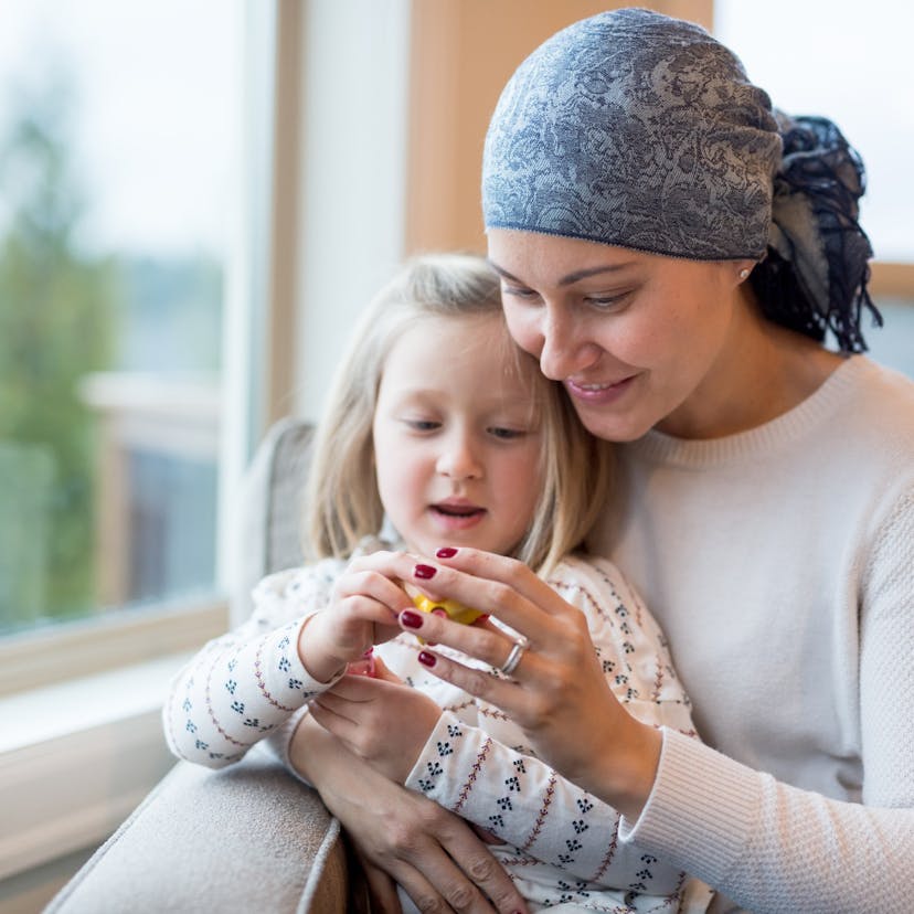 young mom with cancer holds daughter