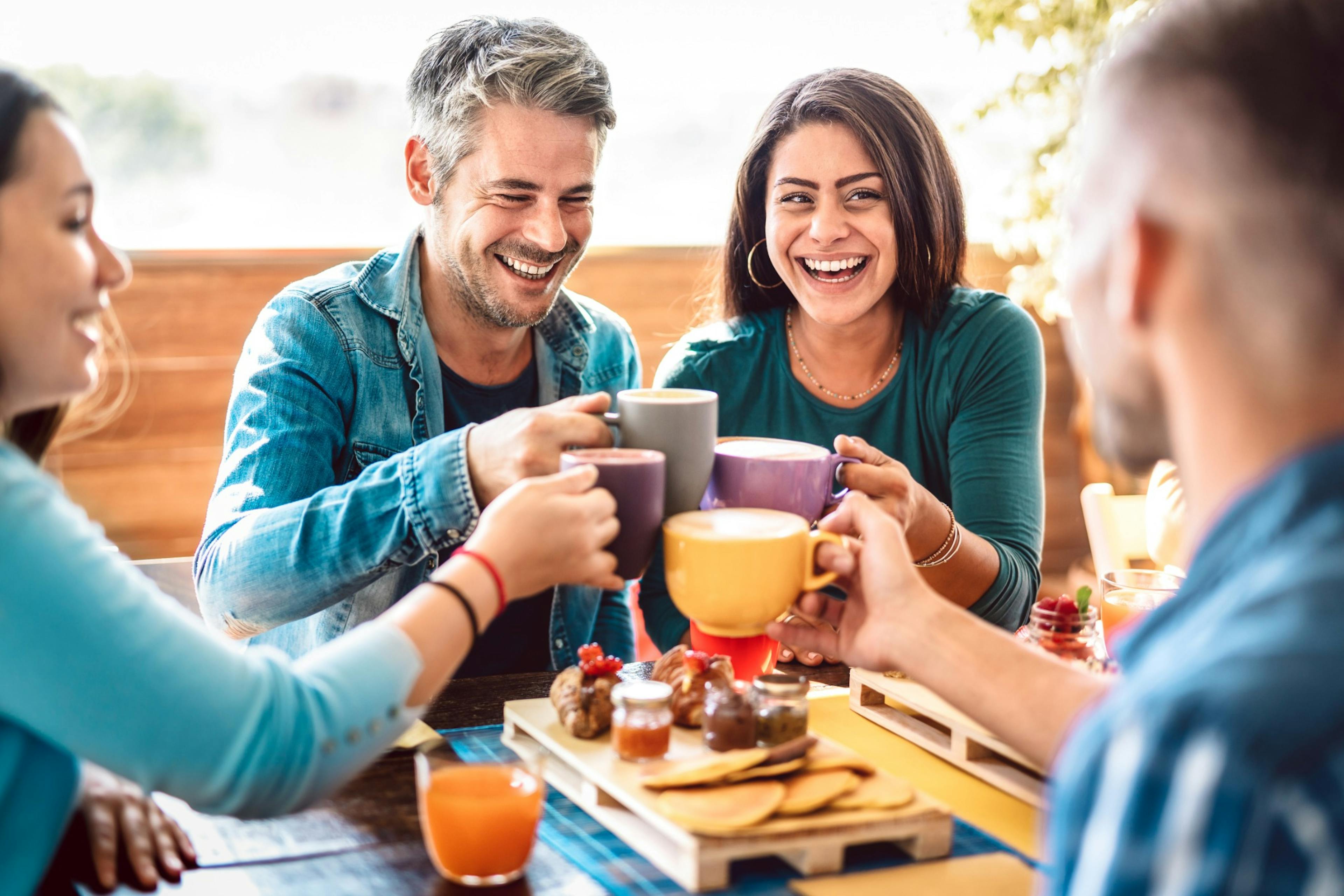 happy couple at brunch with friends