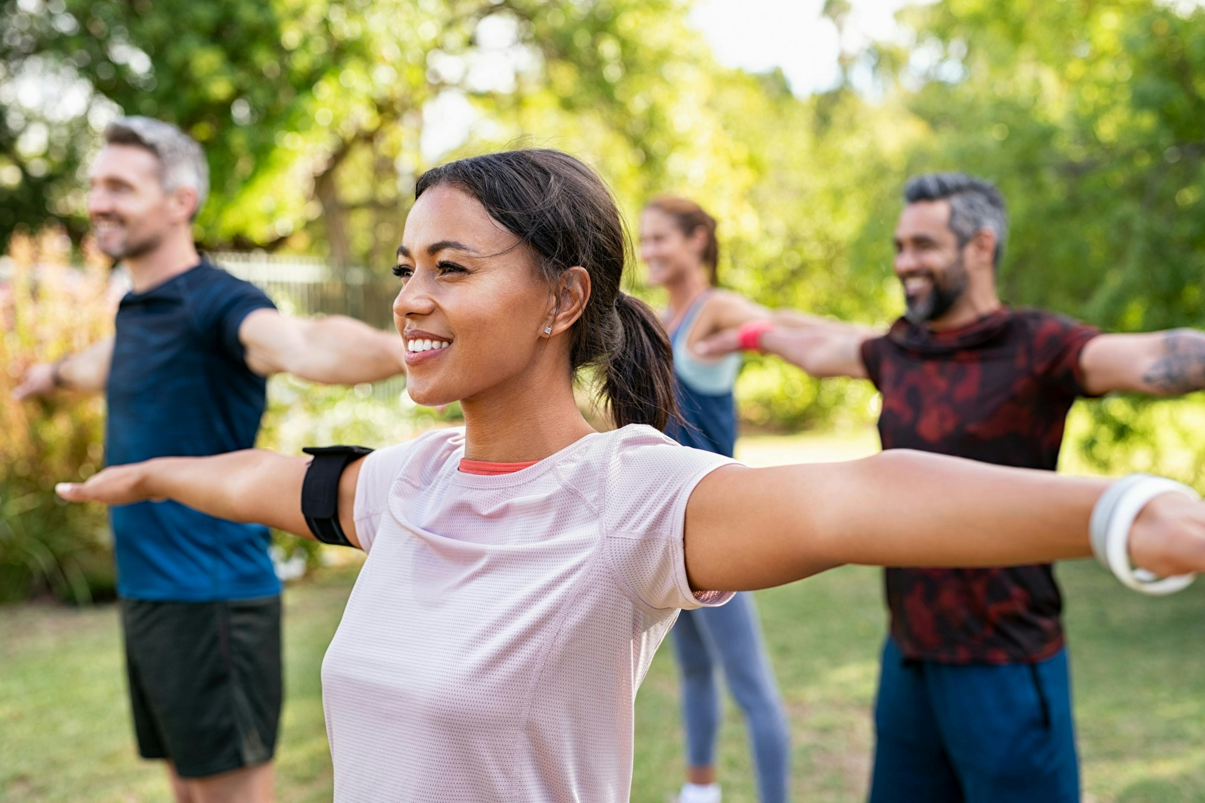 group of happy people working out