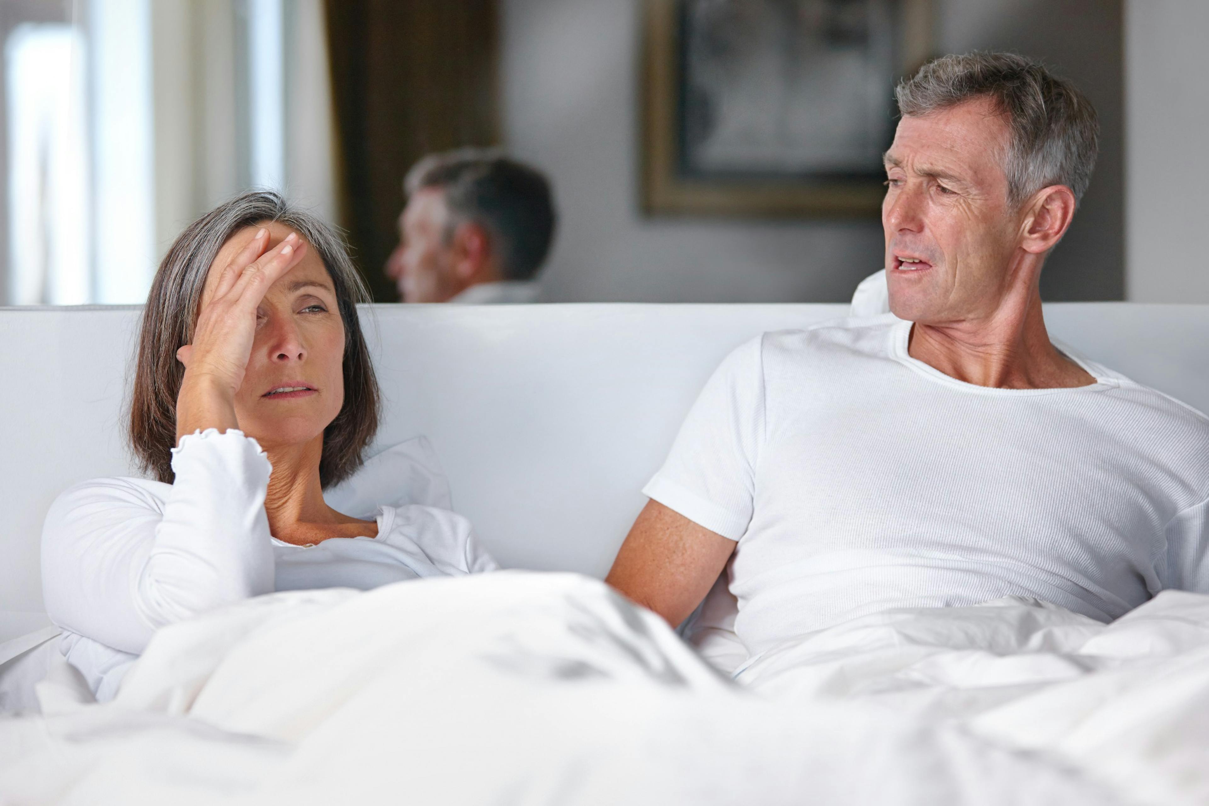 couple arguing in bed