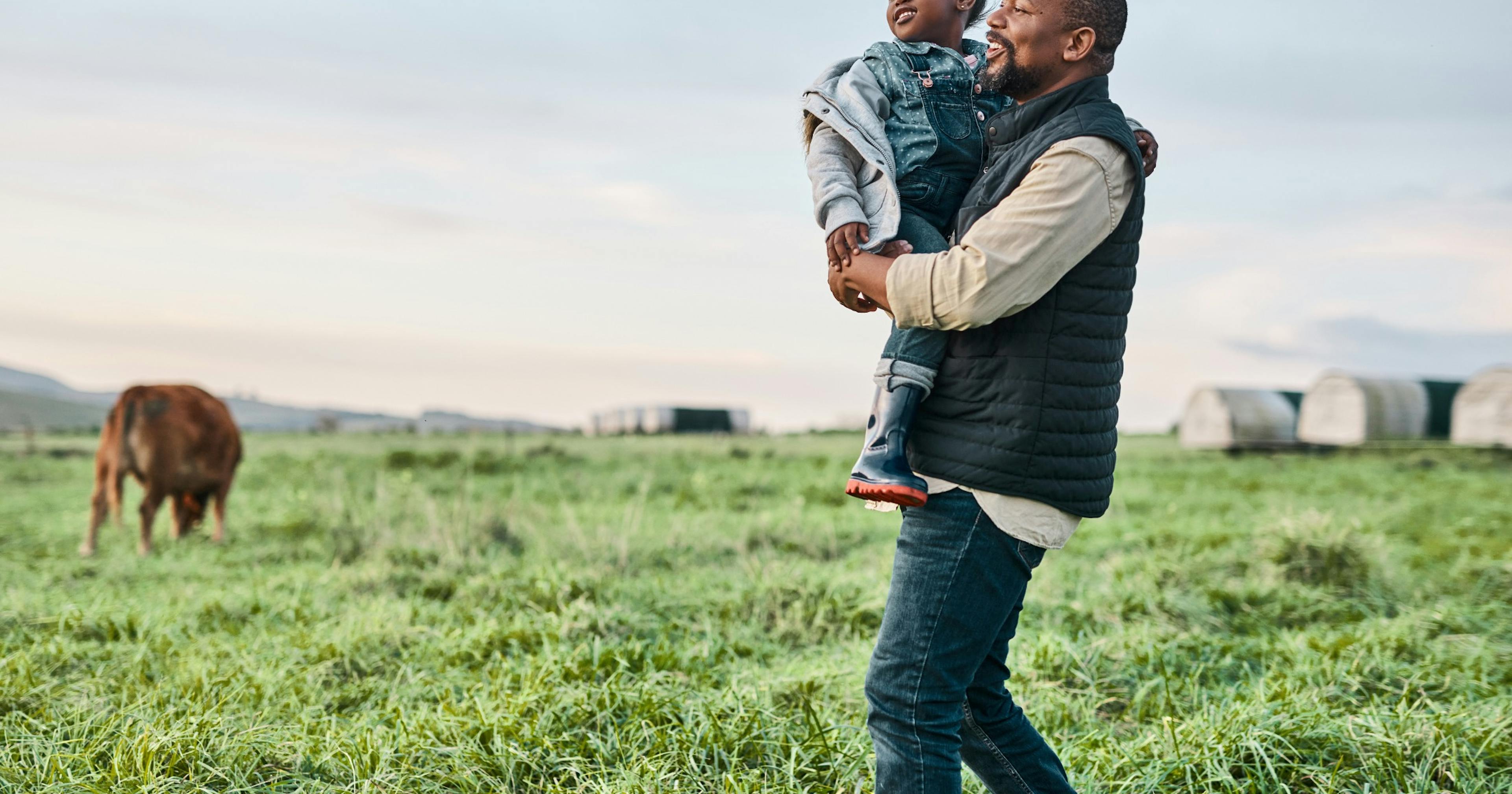 father and daughter at a farm