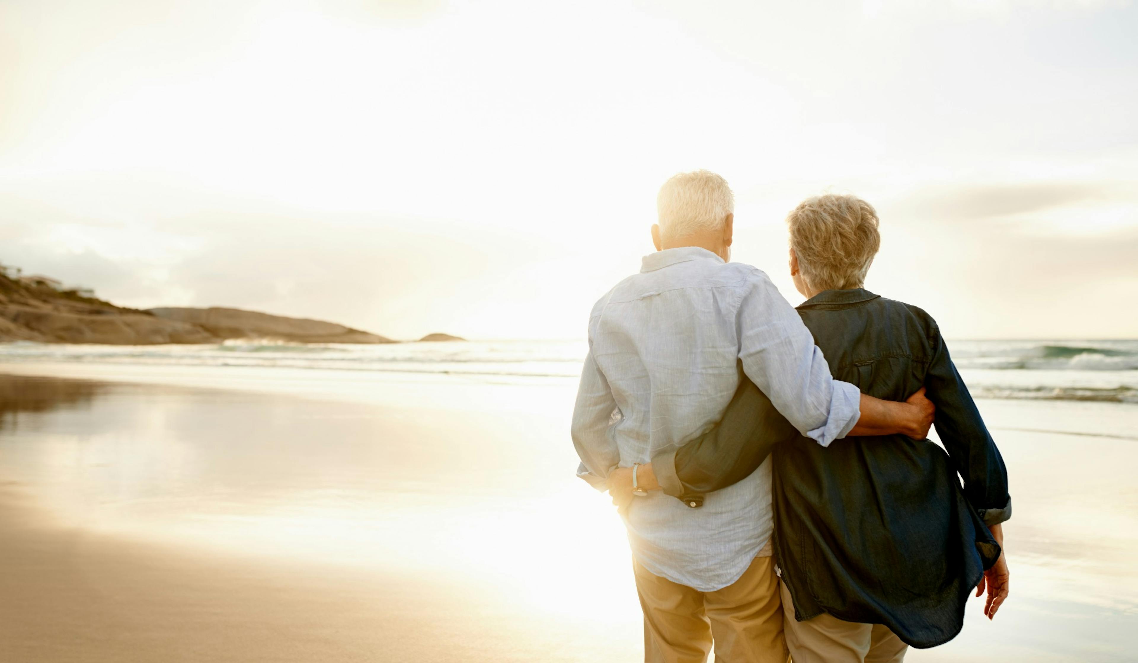 middle age couple at sunset