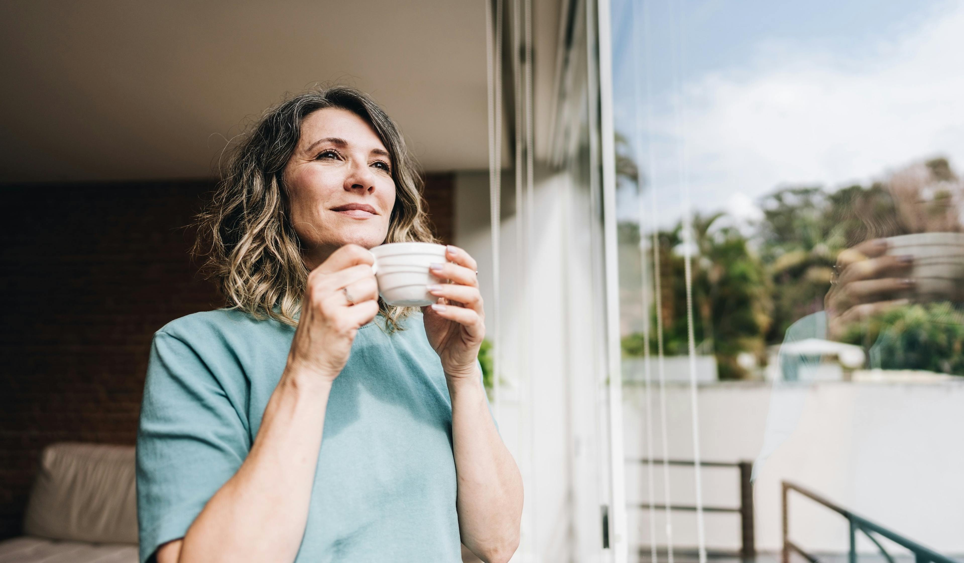 middle age woman drinking coffee