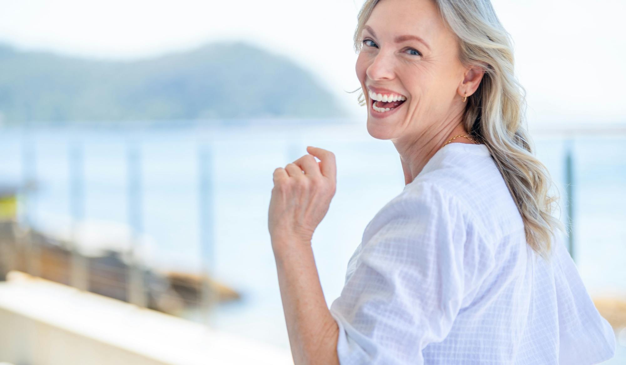 beautiful mature woman at a waterfront house.jpg