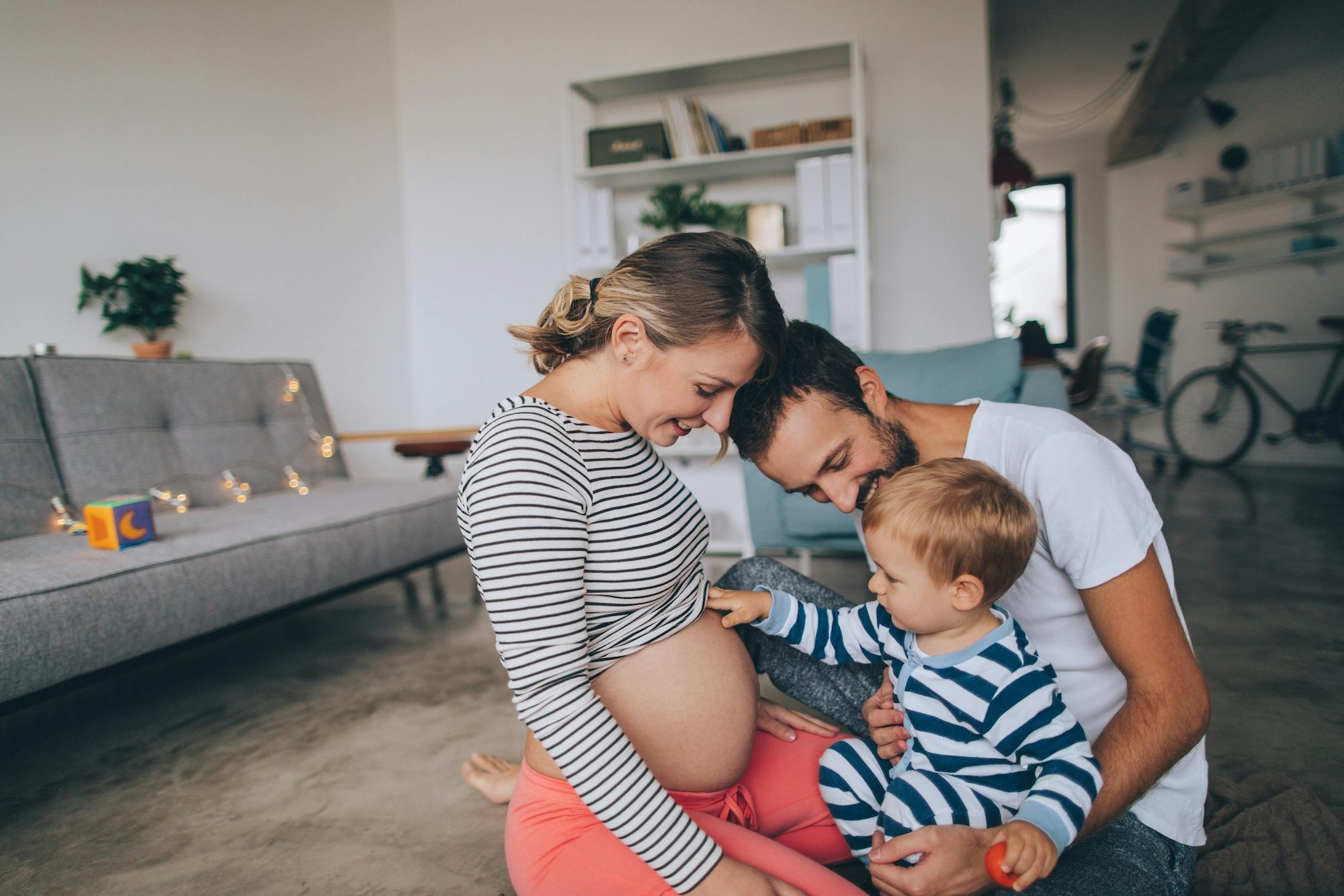 pregnant mom with husband and son