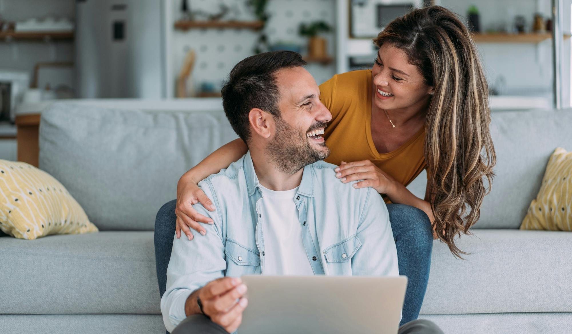couple smiling and working