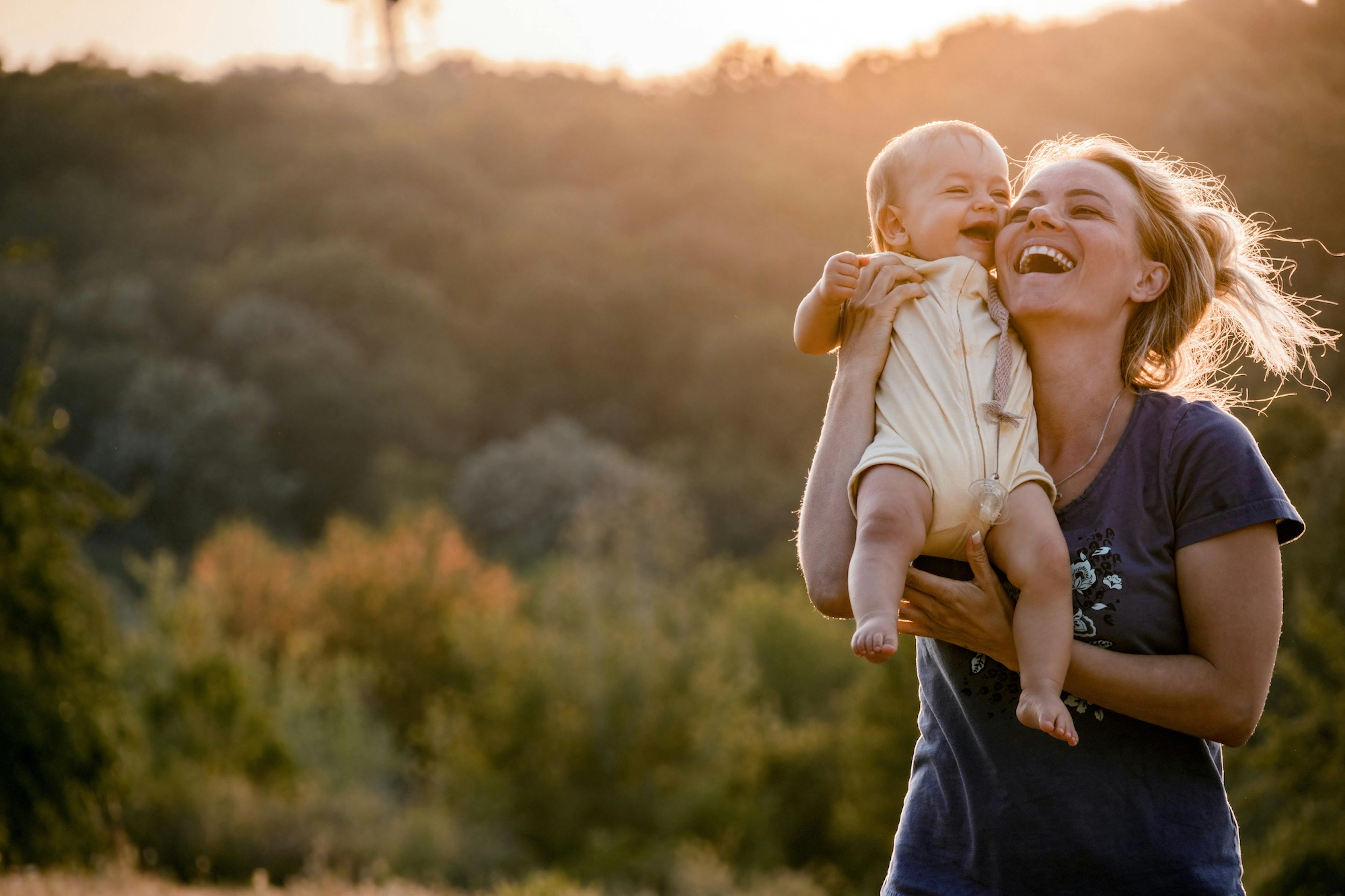 cheerful mother and baby