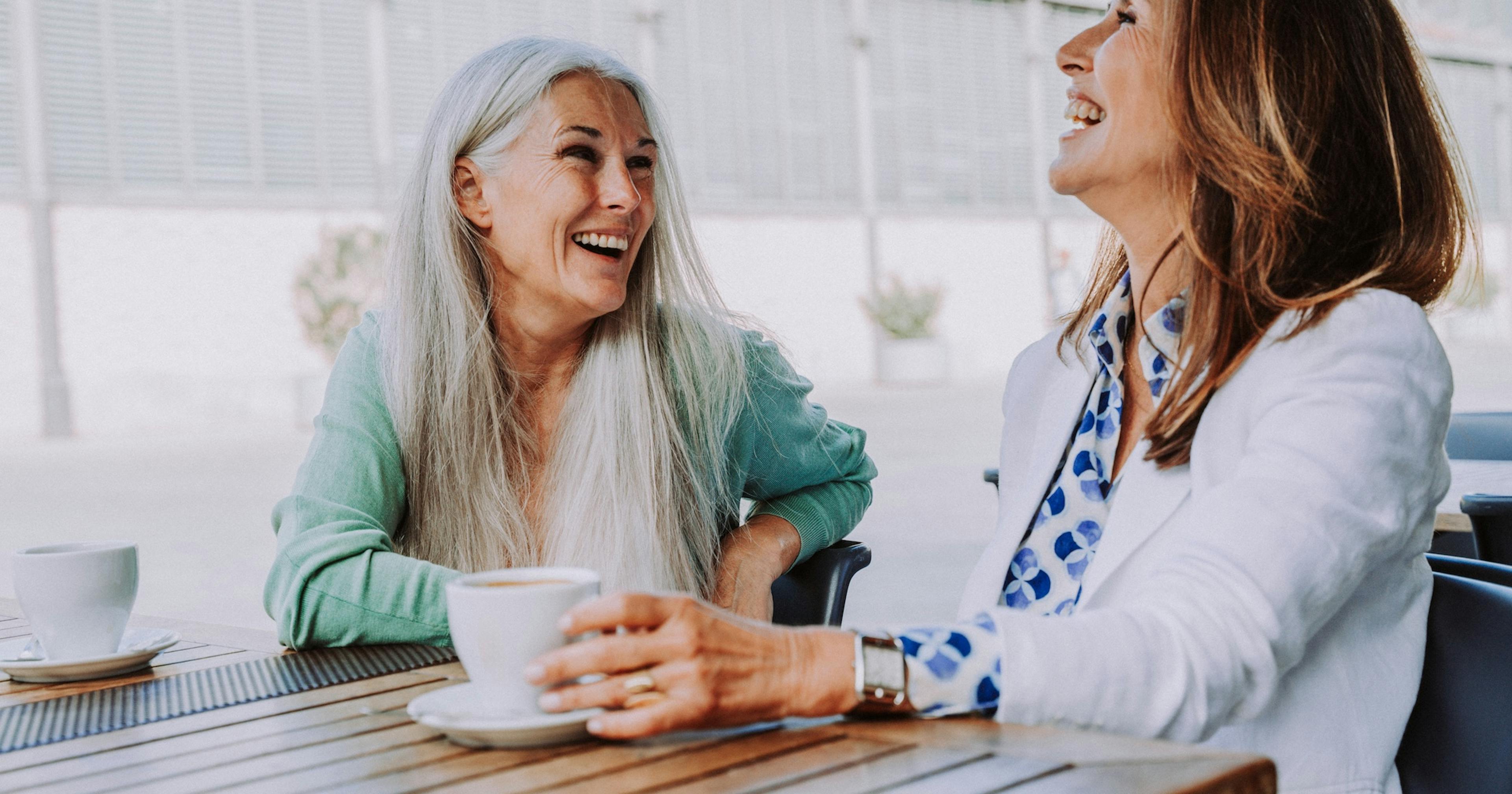 Beautiful senior women meeting outdoors in the city