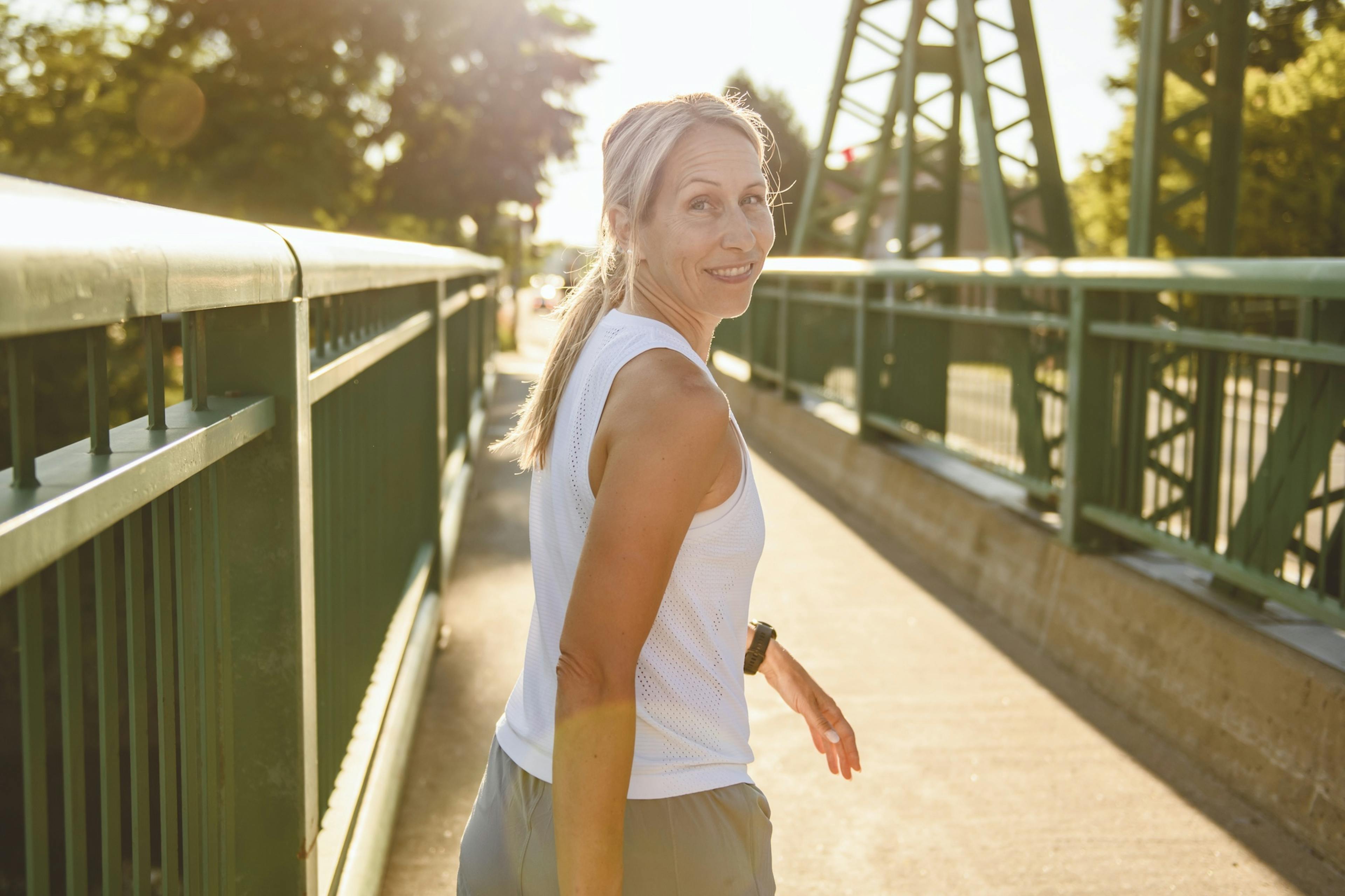 Great sporty woman jogging outdoors