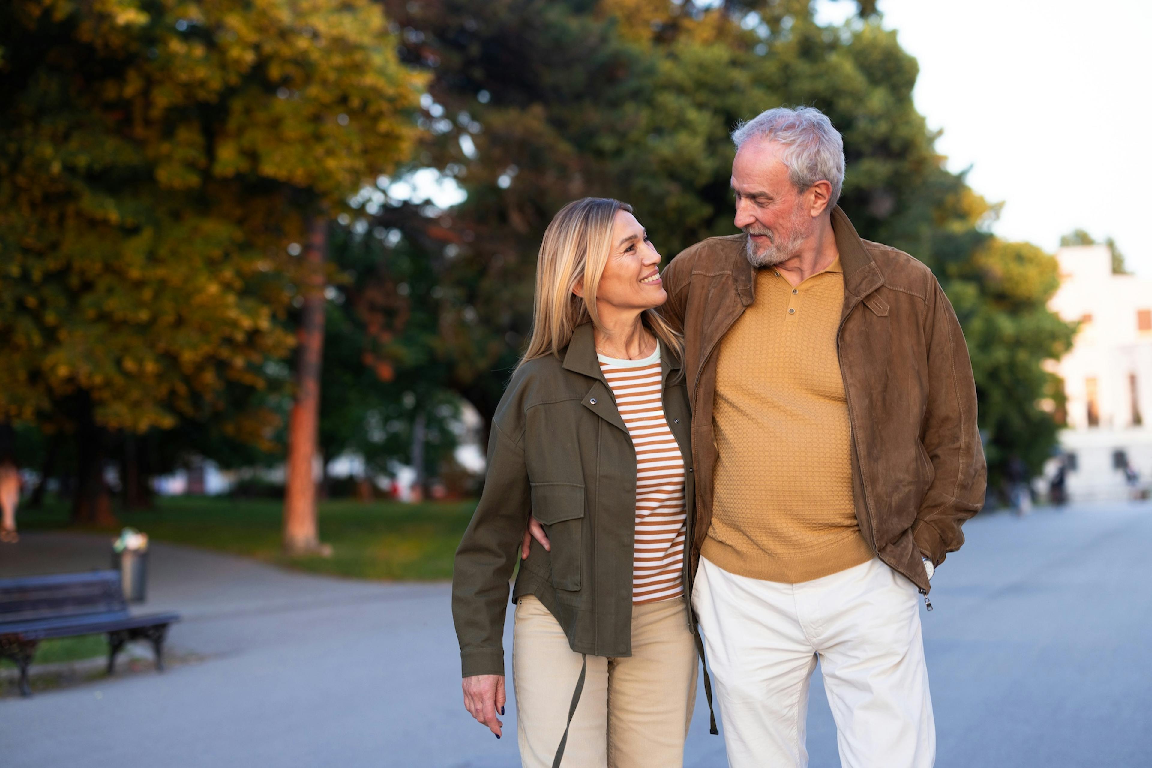couple walking outside in jackets