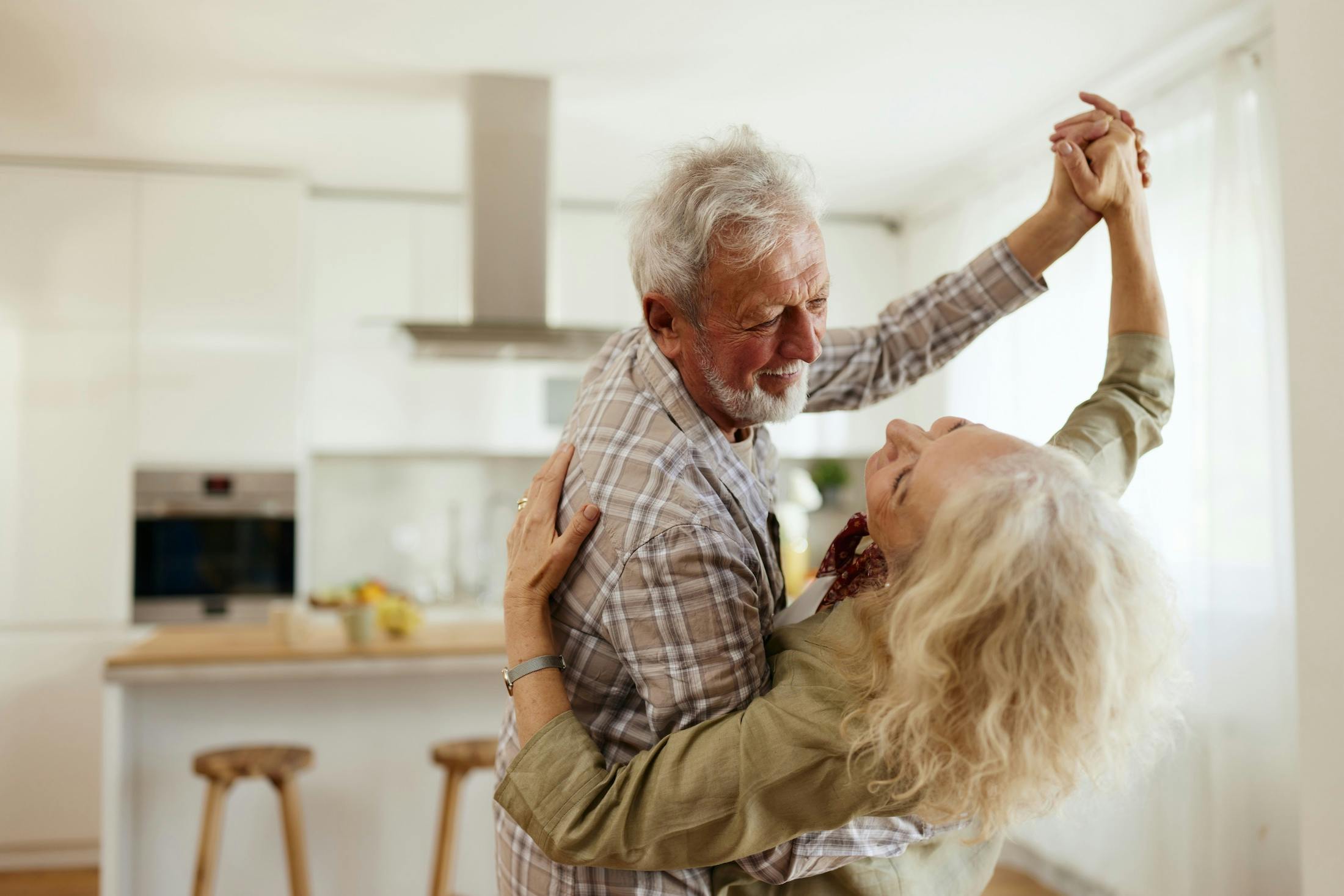 couple dancing in the kitchen