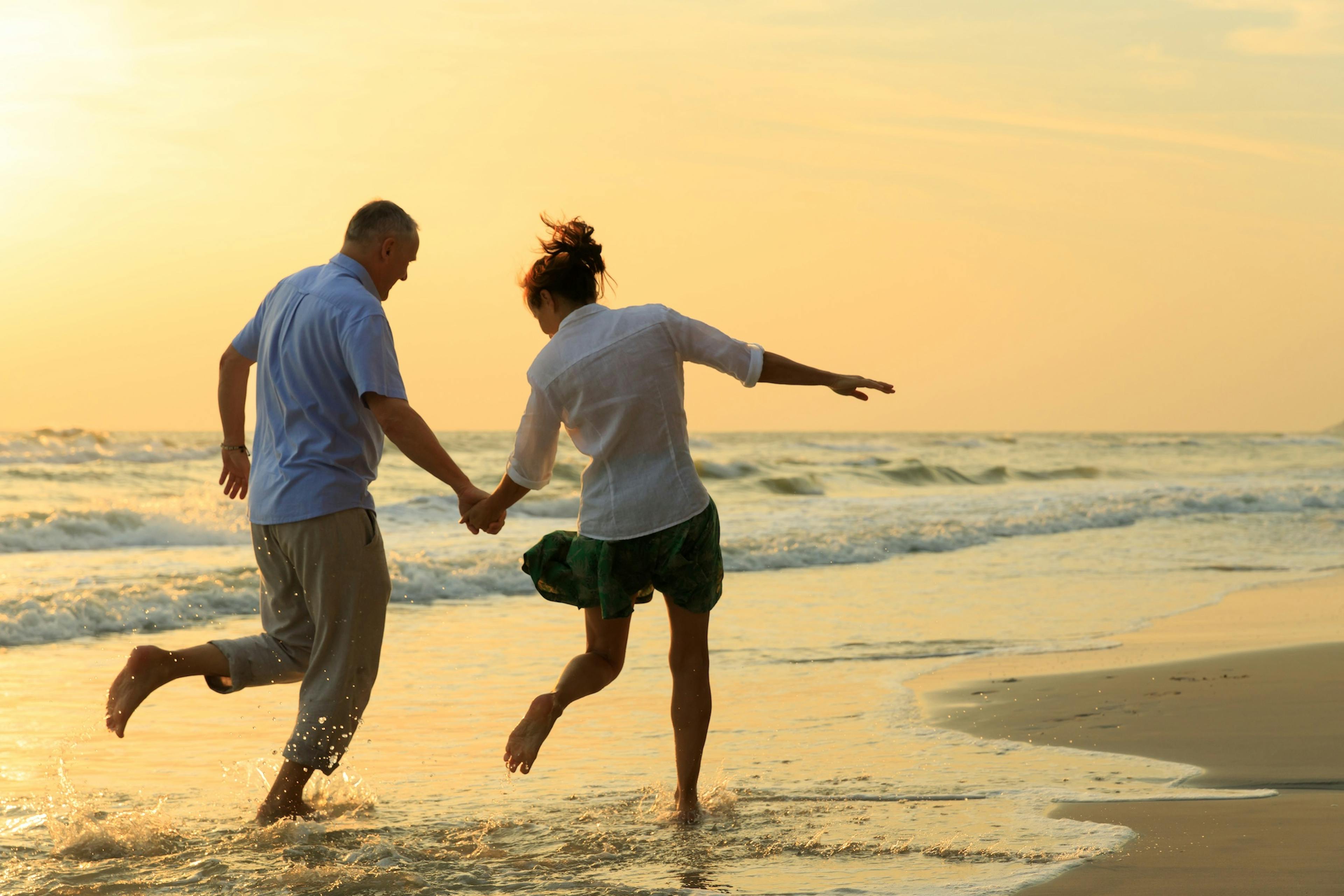 couple running on the beach