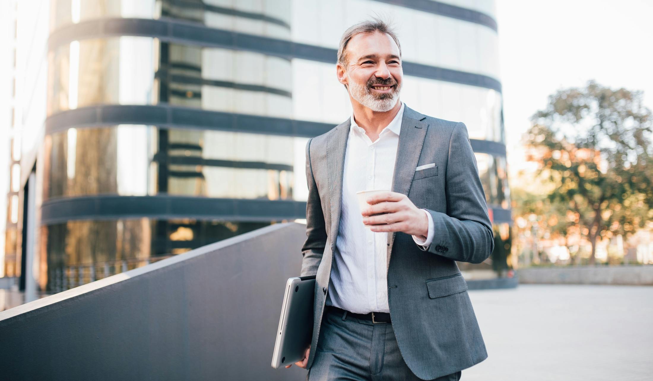 Businessman drinking coffee on his way to work
