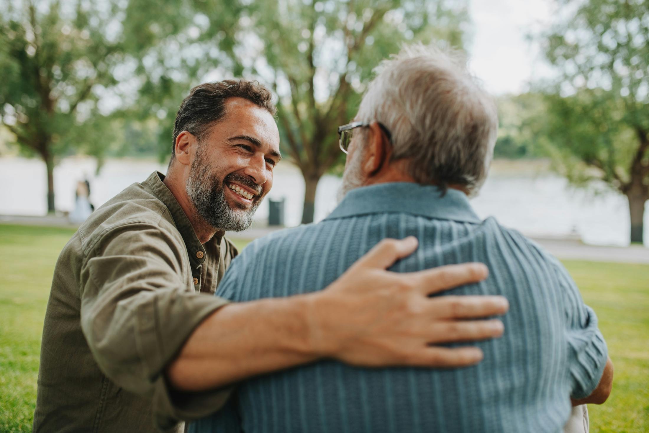 Happy dad and adult son