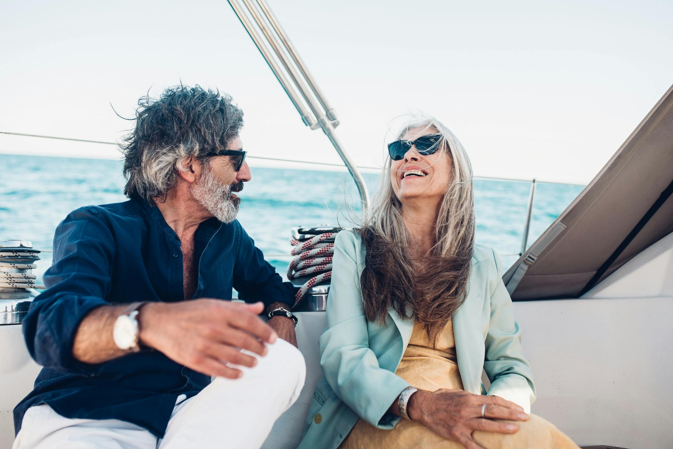 Senior lady enjoying on the yacht with her husband
