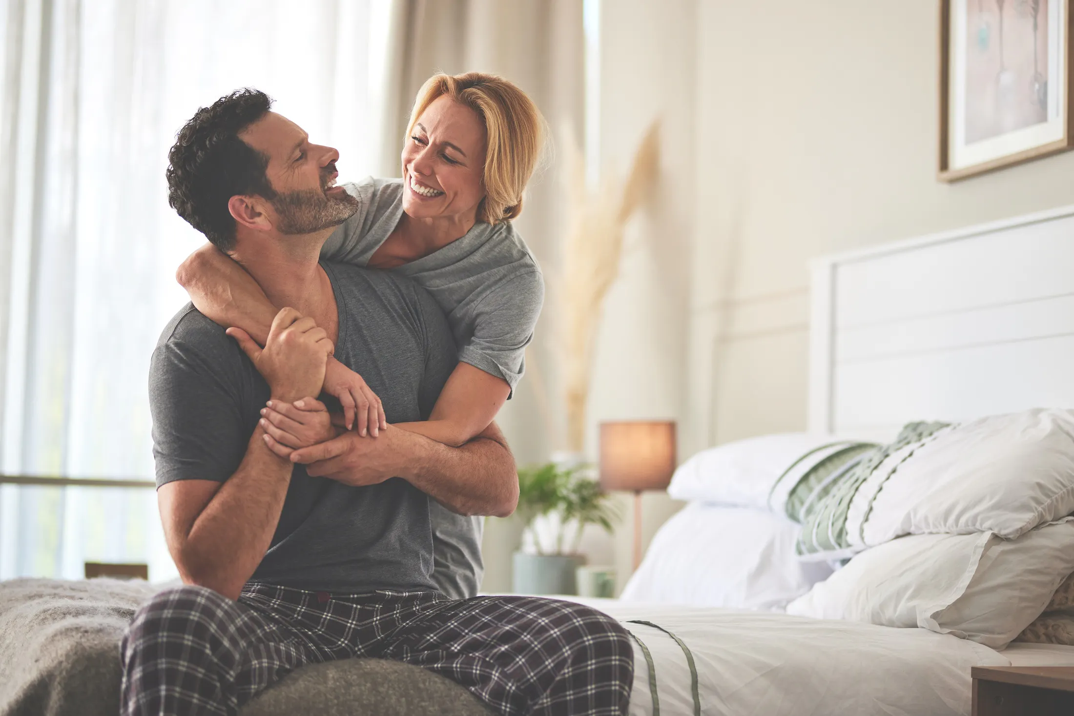 happy couple laughing in the morning