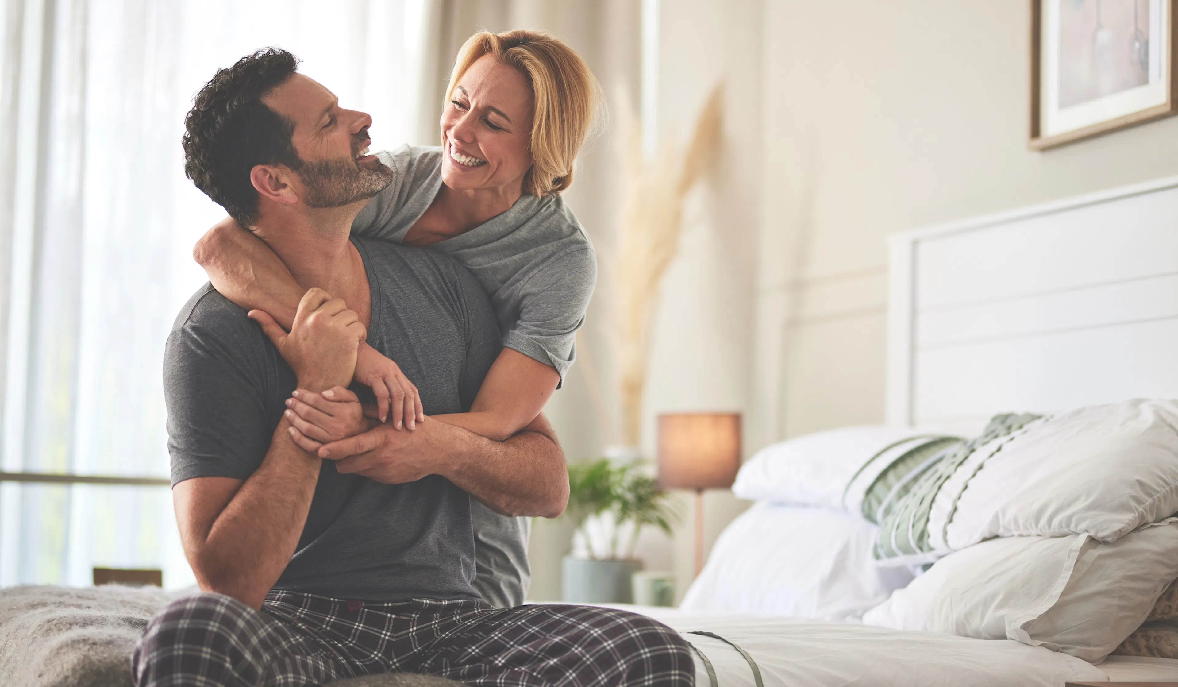 happy couple laughing in the morning