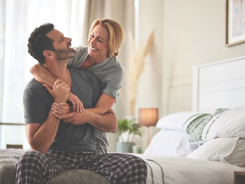 happy couple laughing in the morning