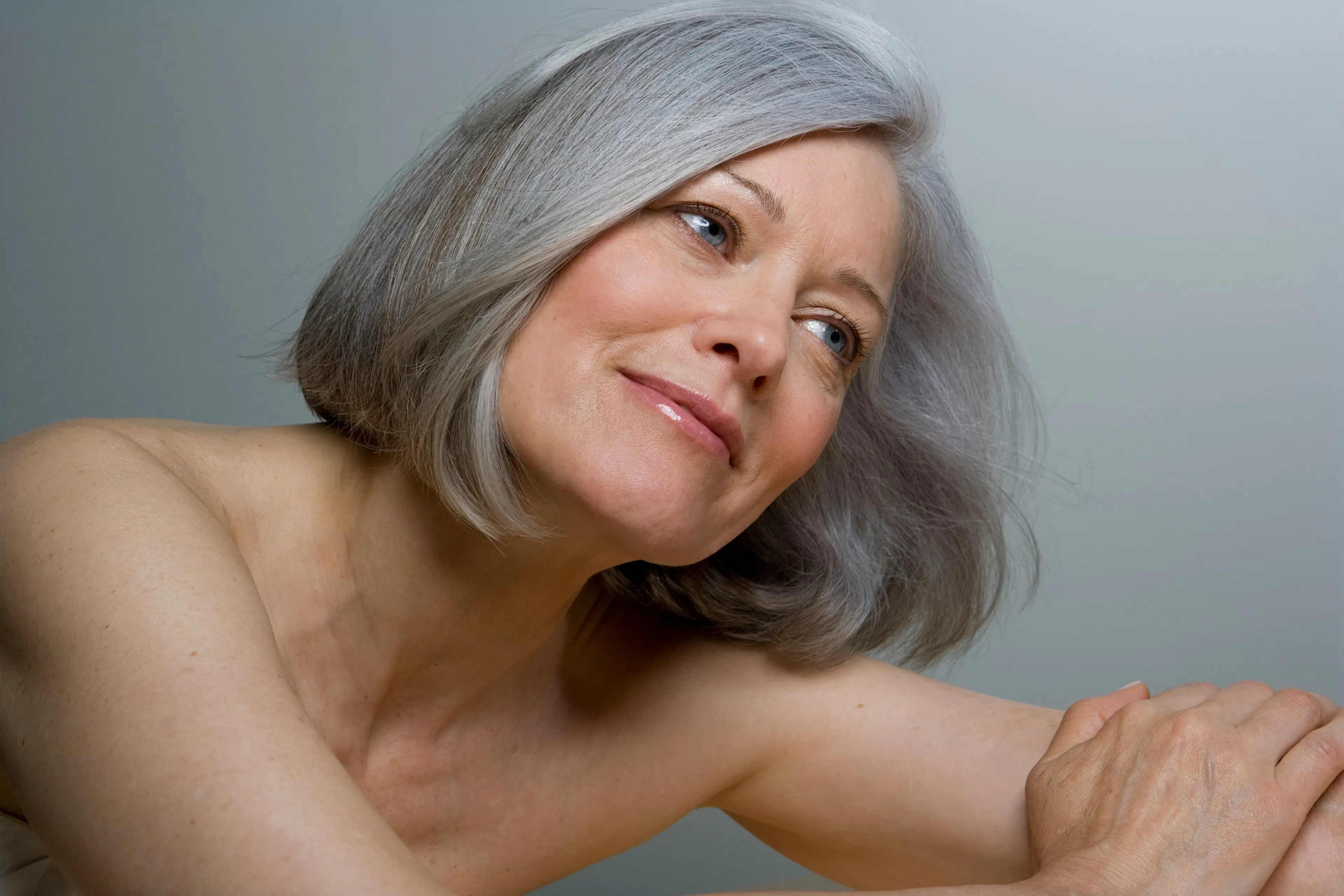 elegant middle age woman with grey hair