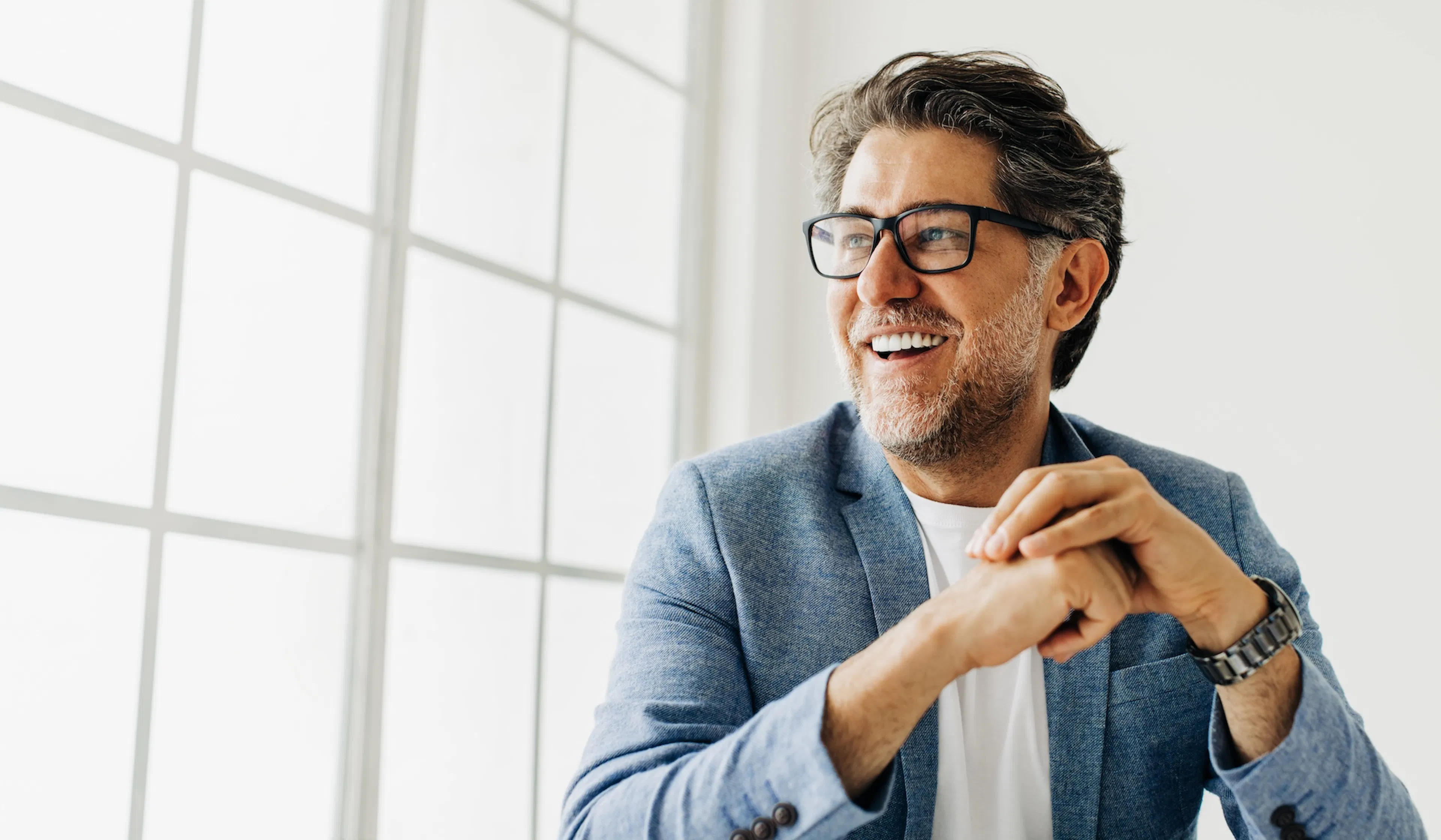 Business man looking outside the window