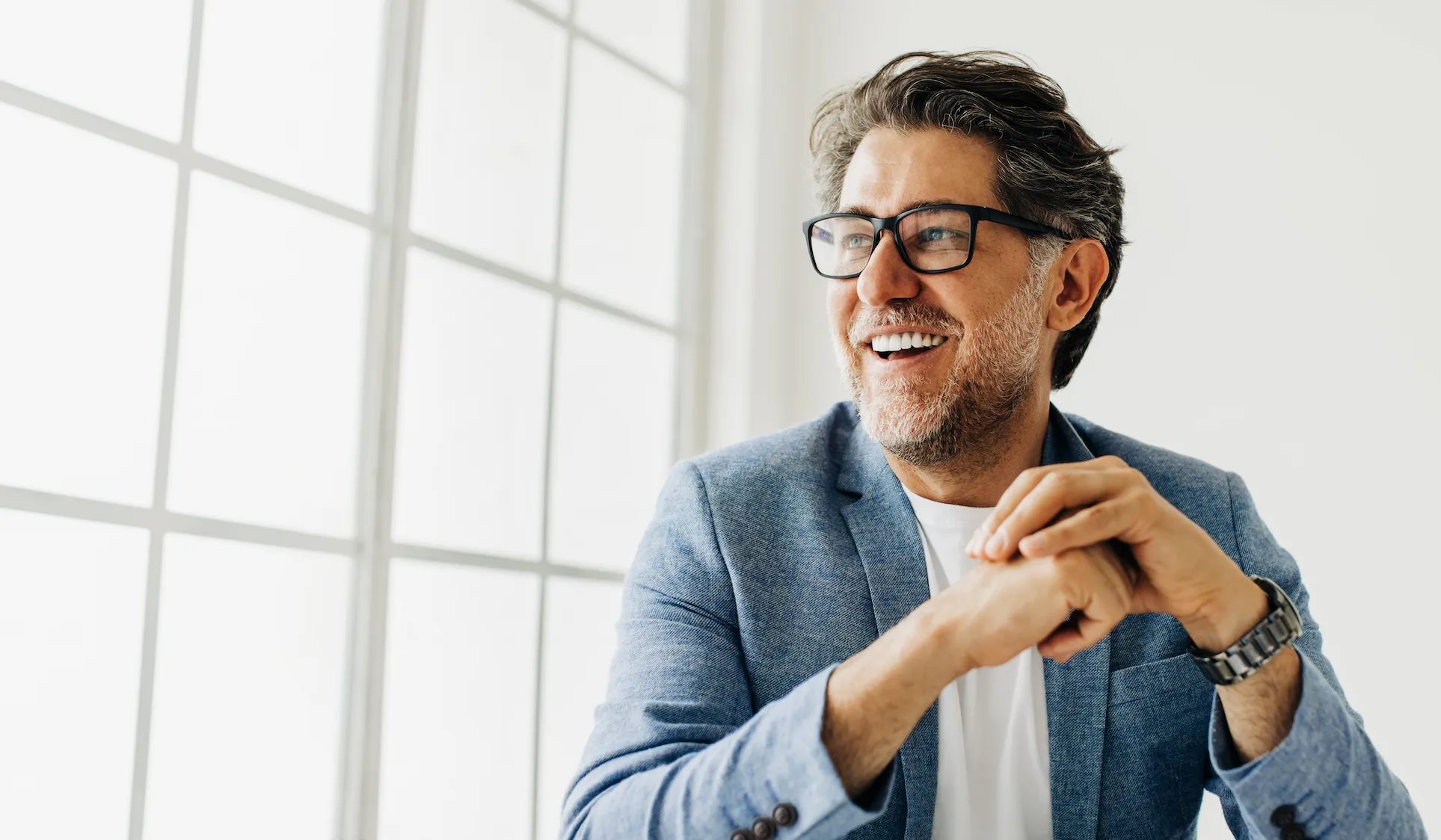 Business man looking outside the window