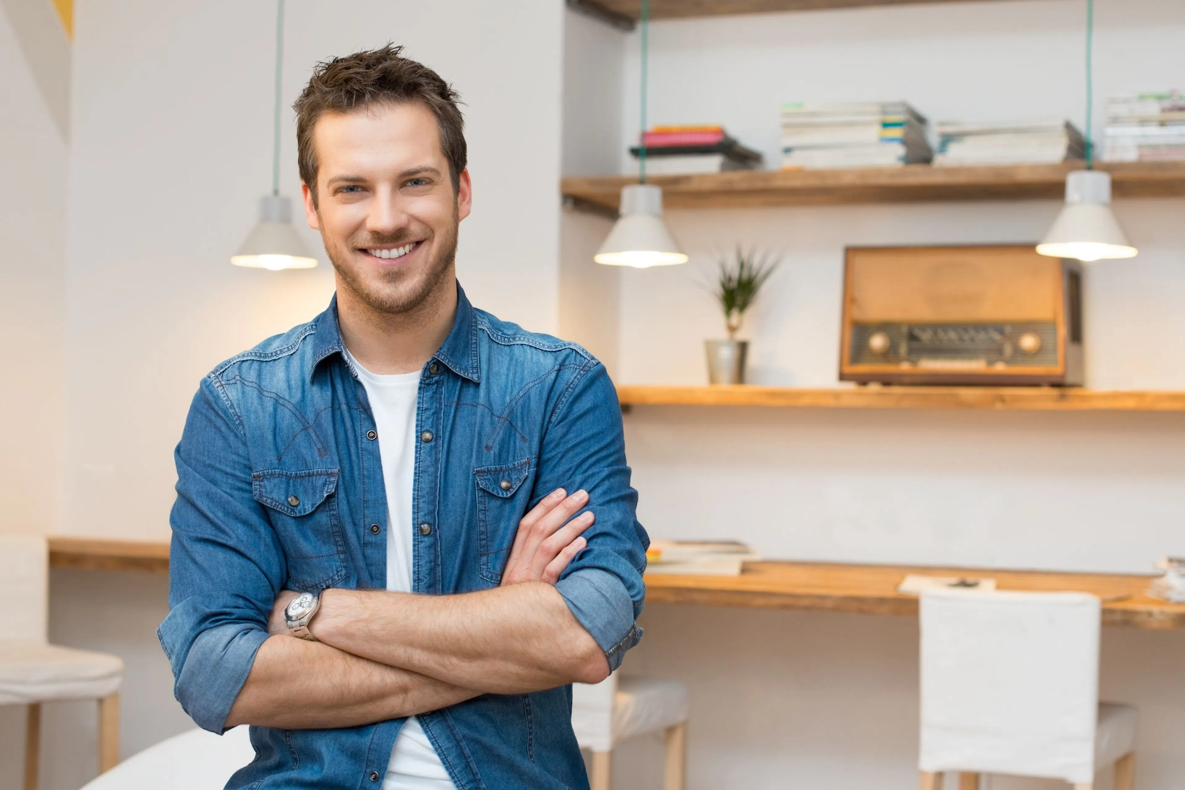 smiling man in a blue shirt