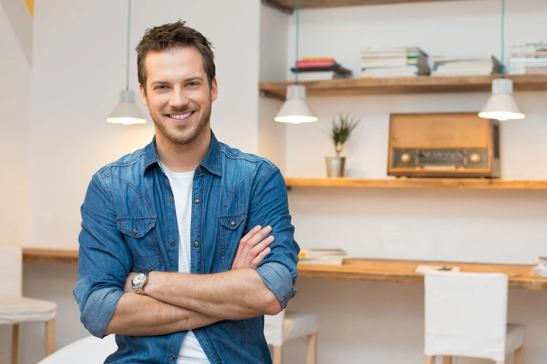 smiling man in a blue shirt