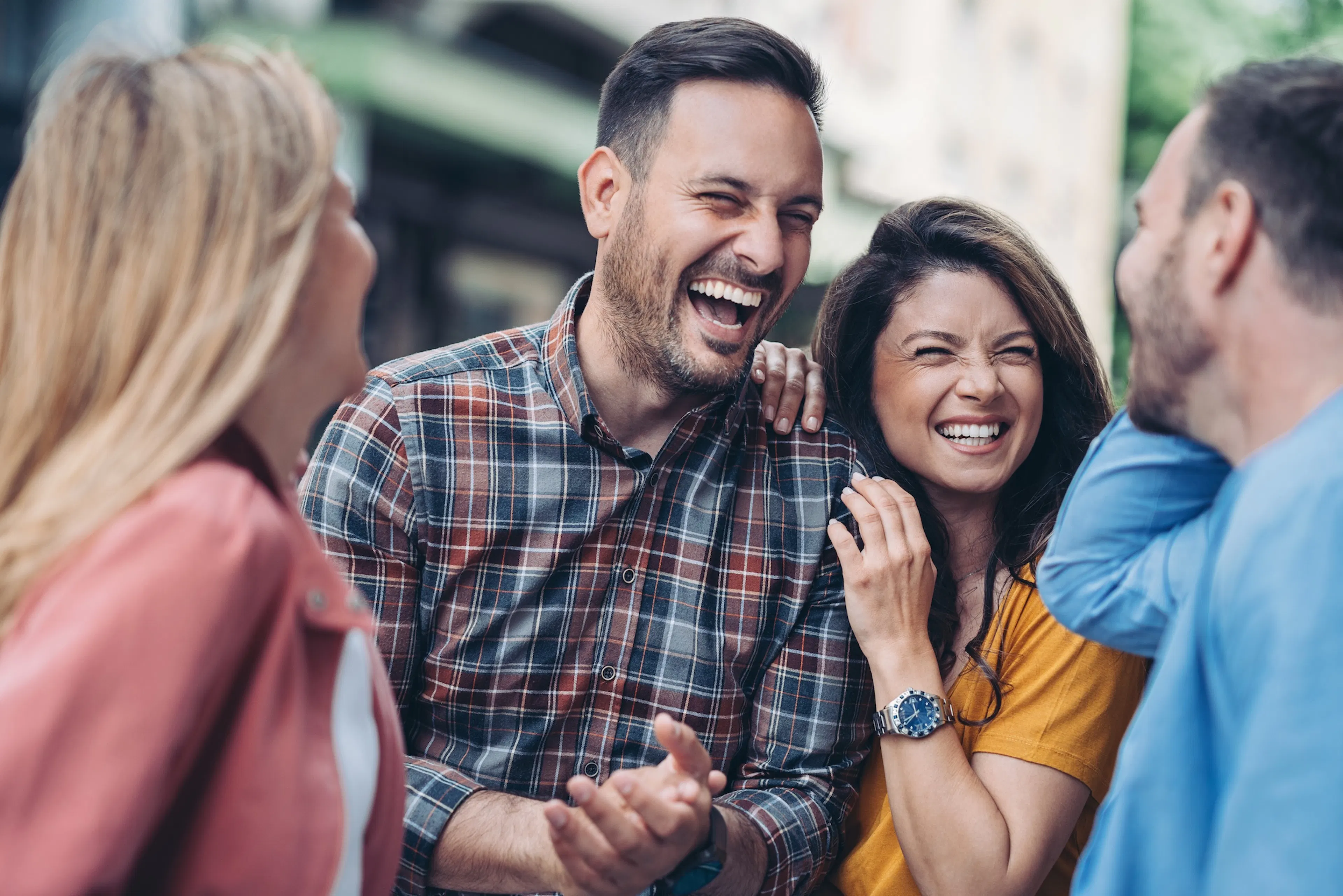 Two couples spend time together outdoors