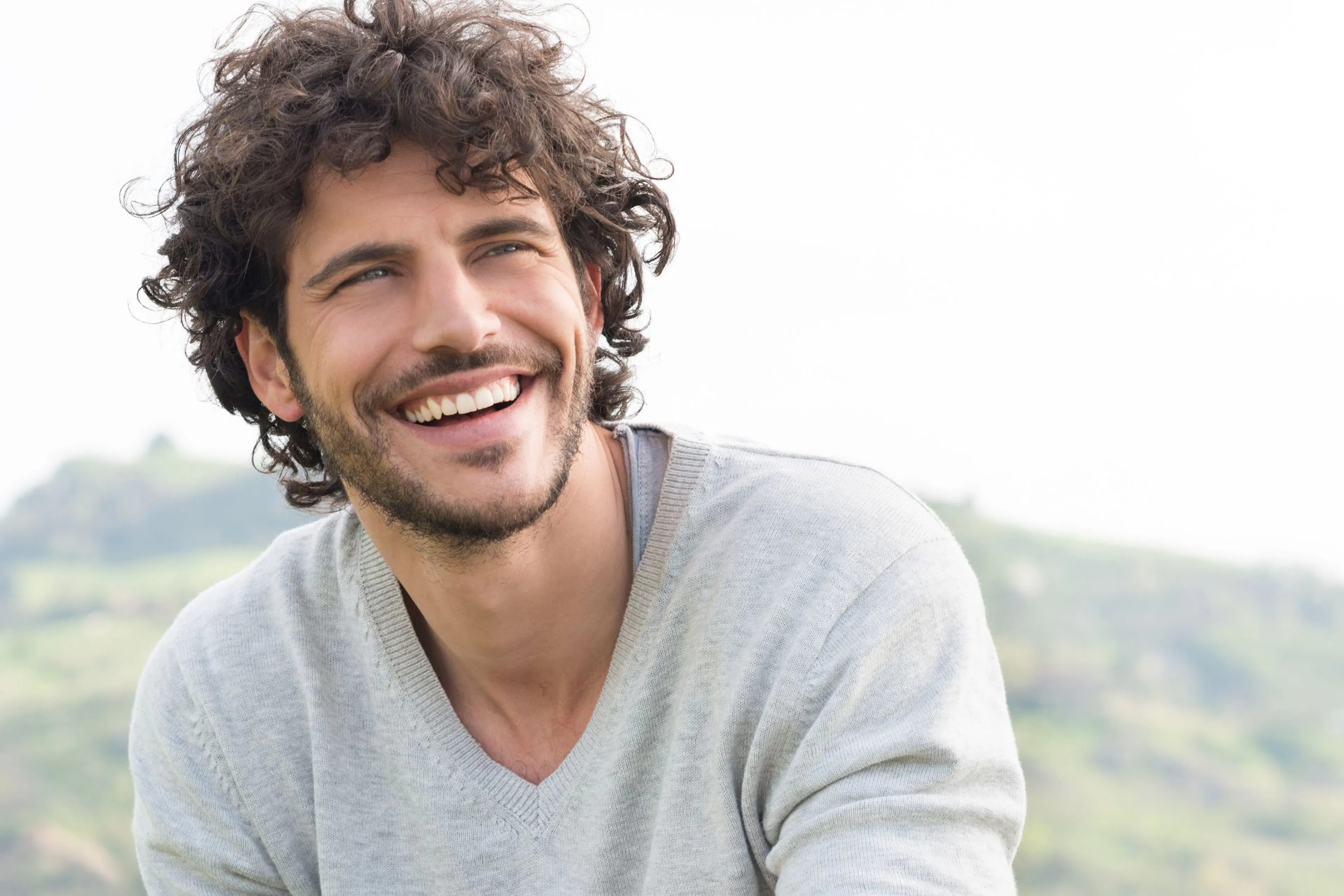 Happy man with a full head of hair